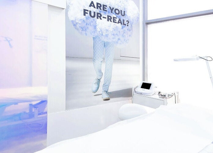 Furless Permanent Muroor Road clinic in Abu Dhabi features a serene, modern treatment room with electrolysis equipment.