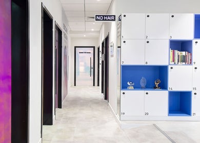 Interior of Furless Permanent Al Quoz showcasing sleek hallway and lockers, Dubai, AE.
