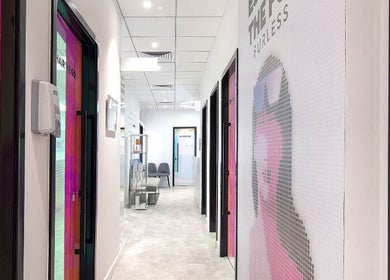 Modern hallway at Furless Permanent Al Quoz (Dubai/Electrolysis) in Dubai, AE with artistic wall designs.