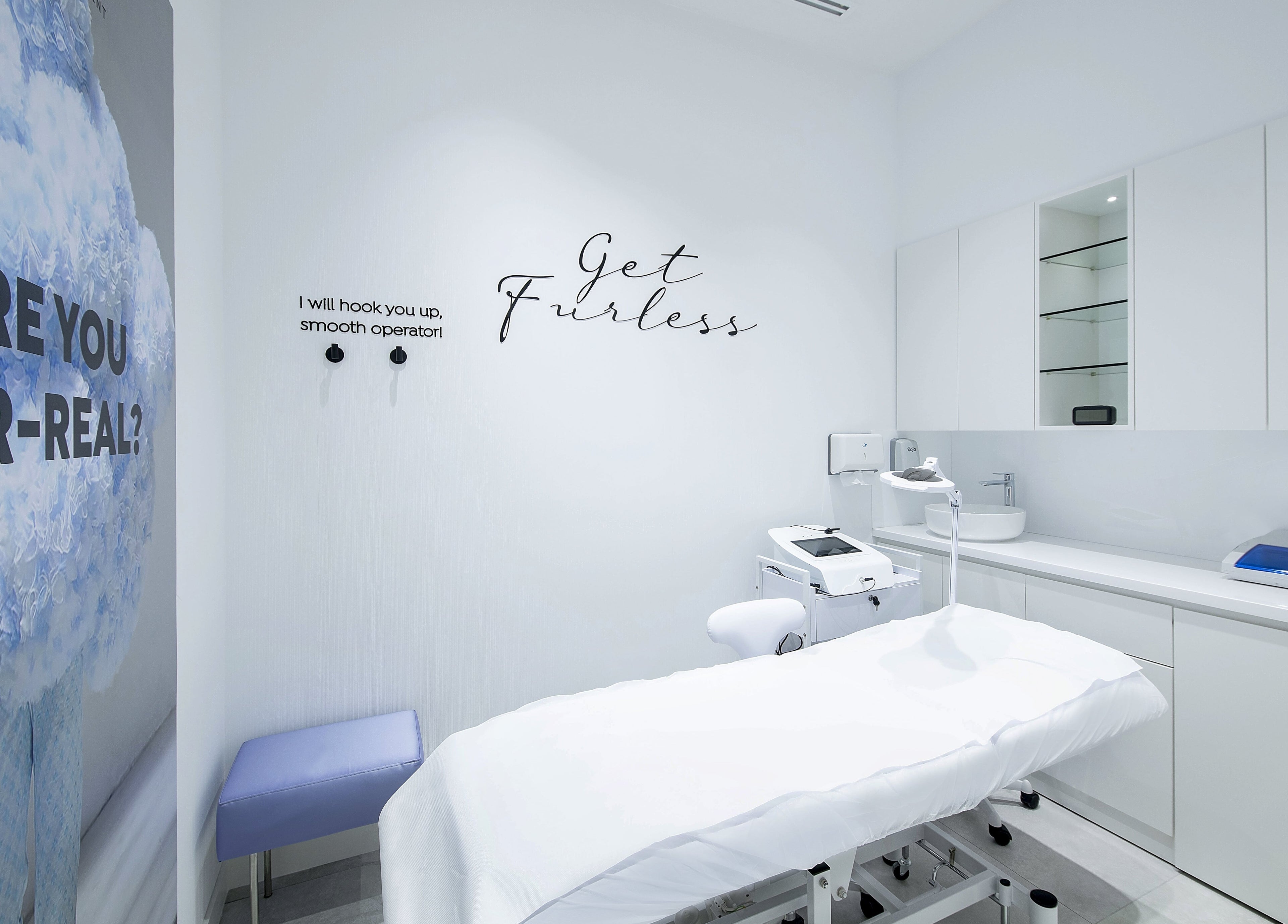Bright electrolysis room at Furless Permanent Rabdan Mall, Abu Dhabi, AE with treatment bed and equipment.