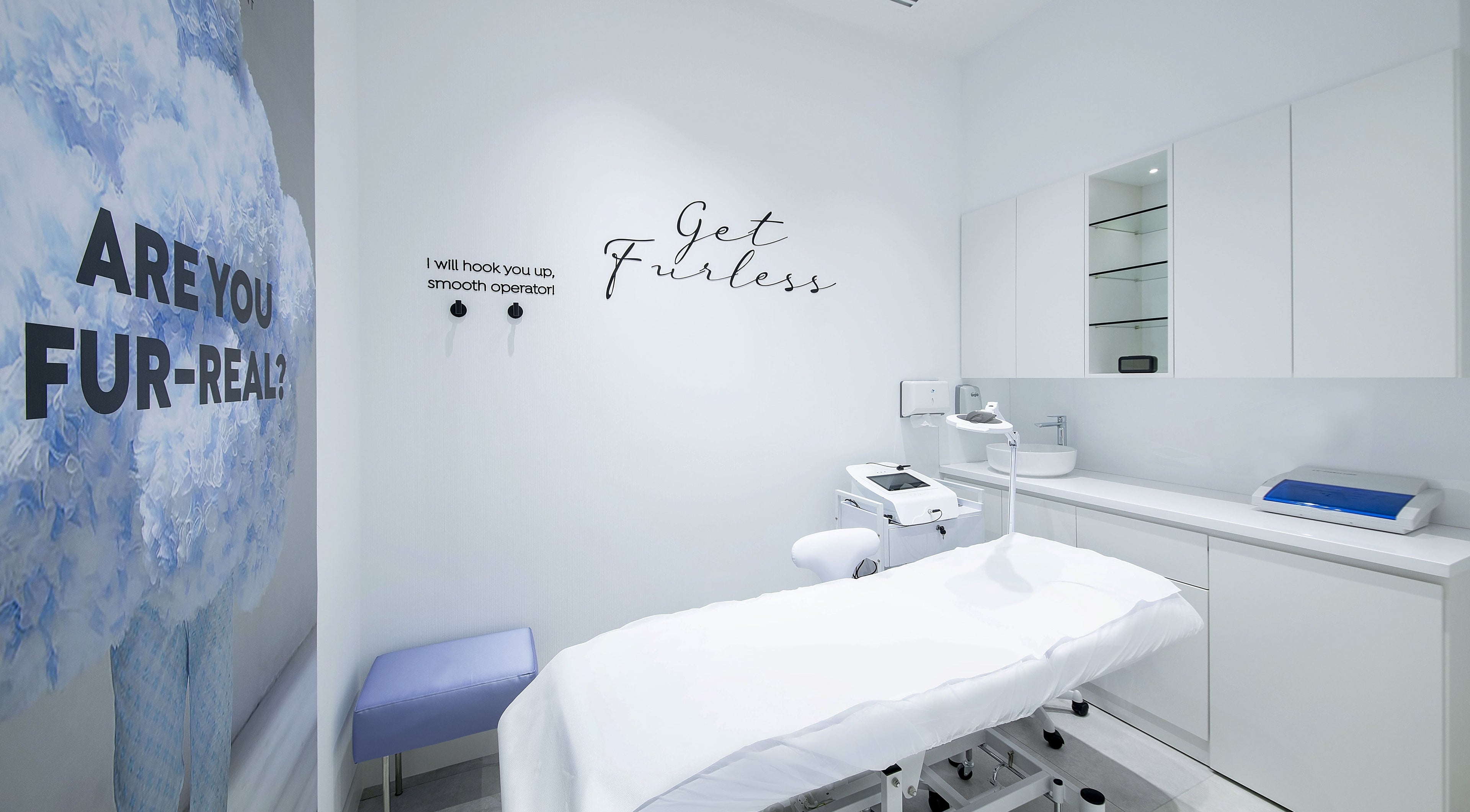 Bright electrolysis room at Furless Permanent Rabdan Mall, Abu Dhabi, AE with treatment bed and equipment.