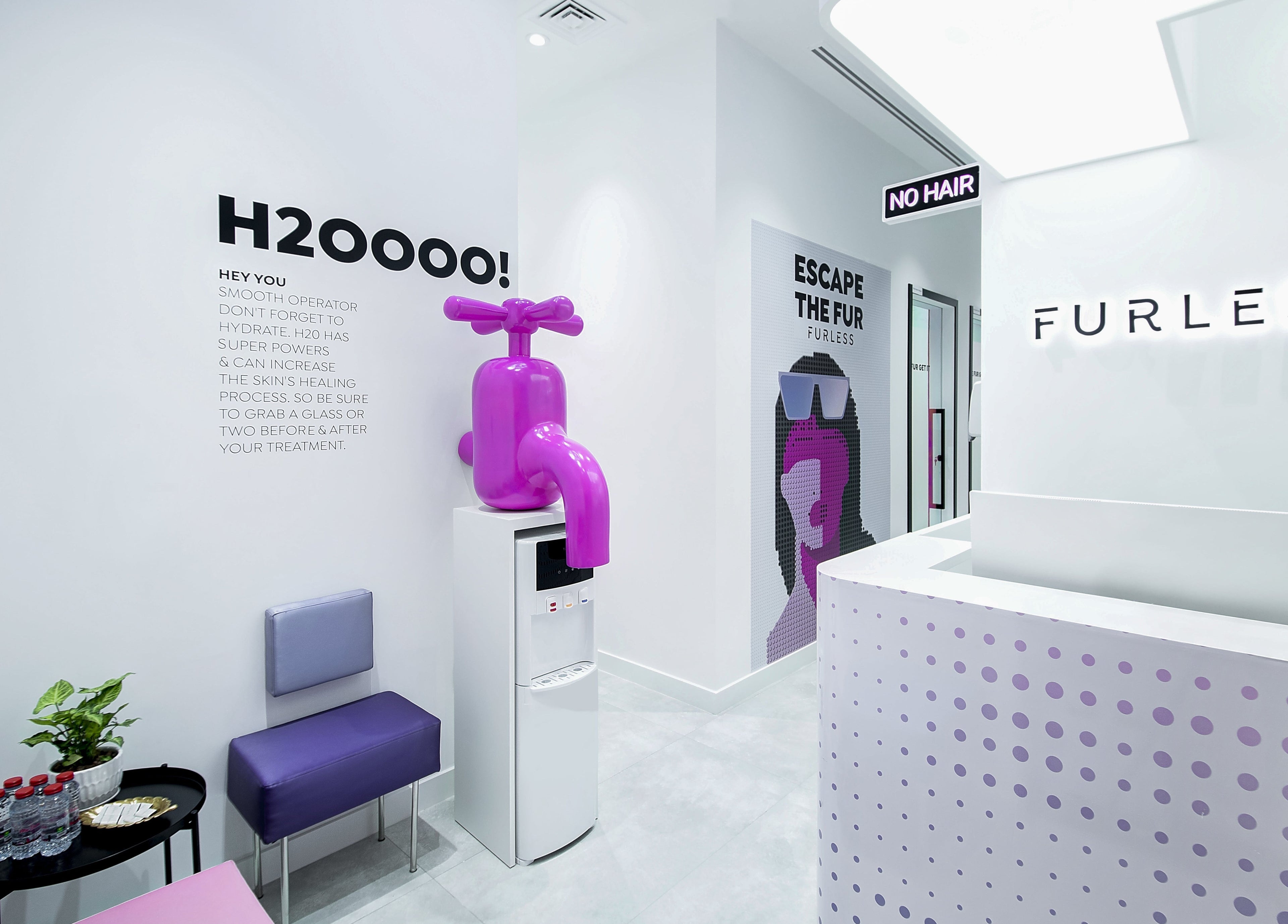 Reception area at Furless Permanent Rabdan Mall, Abu Dhabi with modern decor and bright signage.