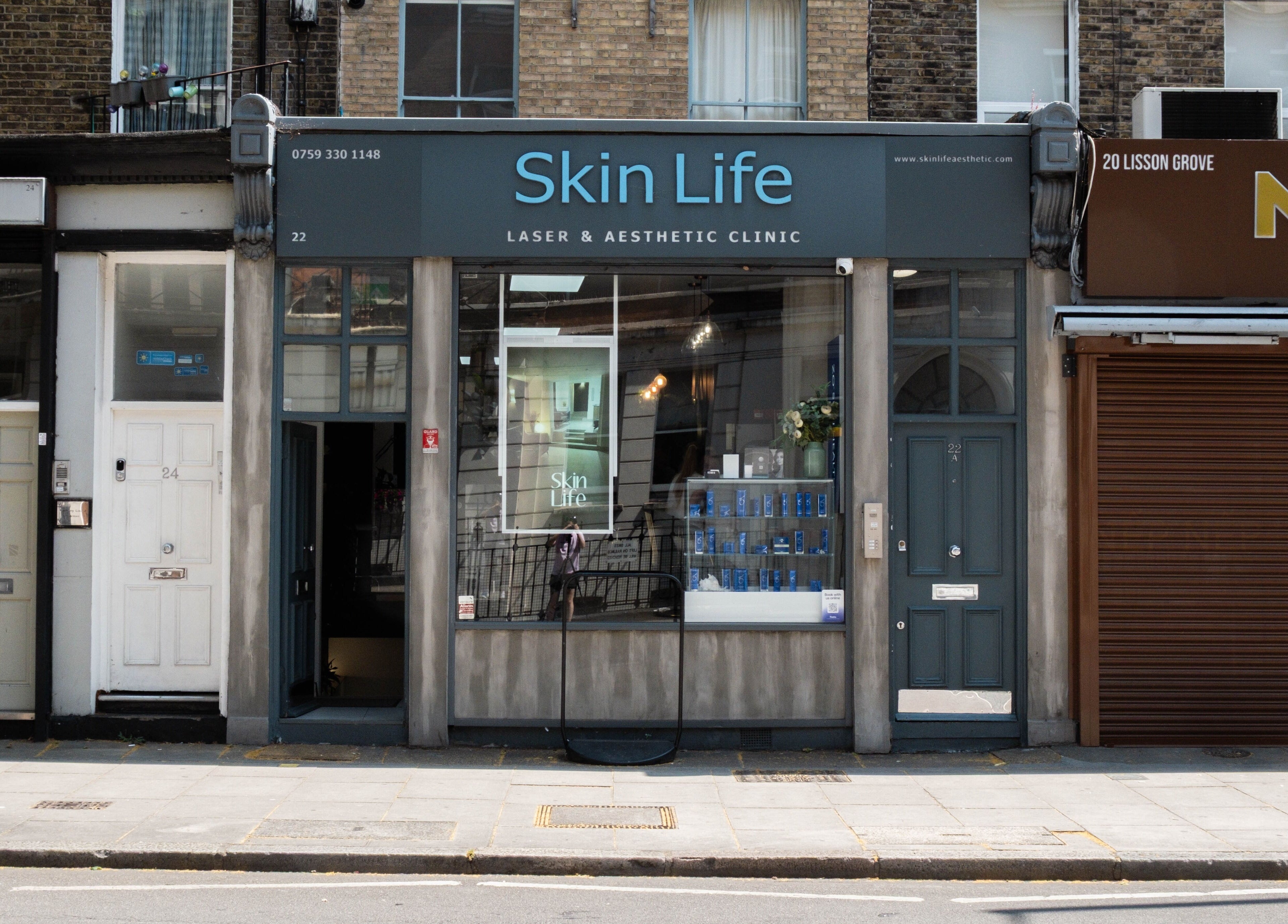 Front view of a stylish laser and aesthetic clinic with neutral tones in London, England, GB nearby Viktoria Pereviazko Professional Nails Artist.