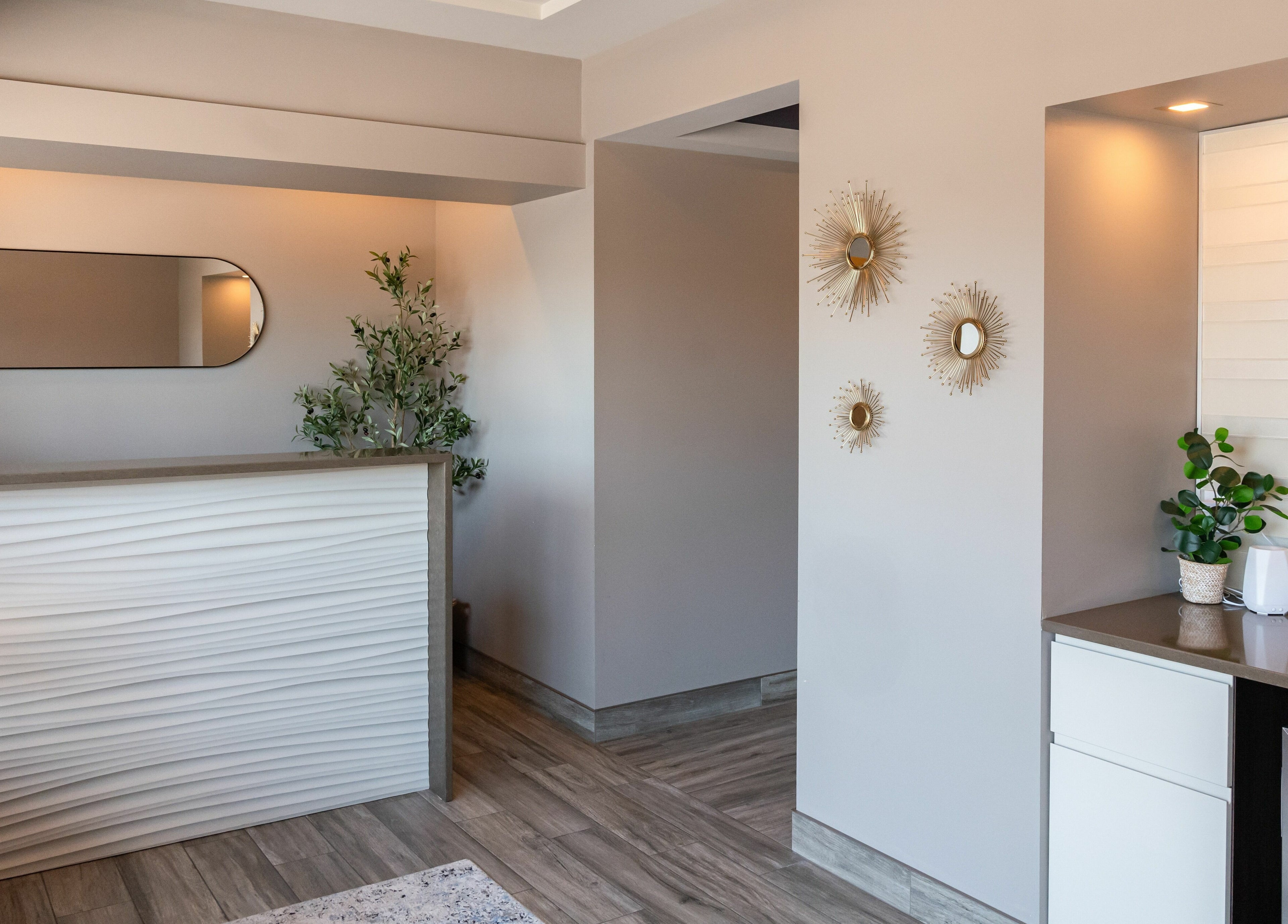 Elegant reception area at Melt Body Health, Windsor, Ontario, CA, featuring modern decor and calming ambiance.