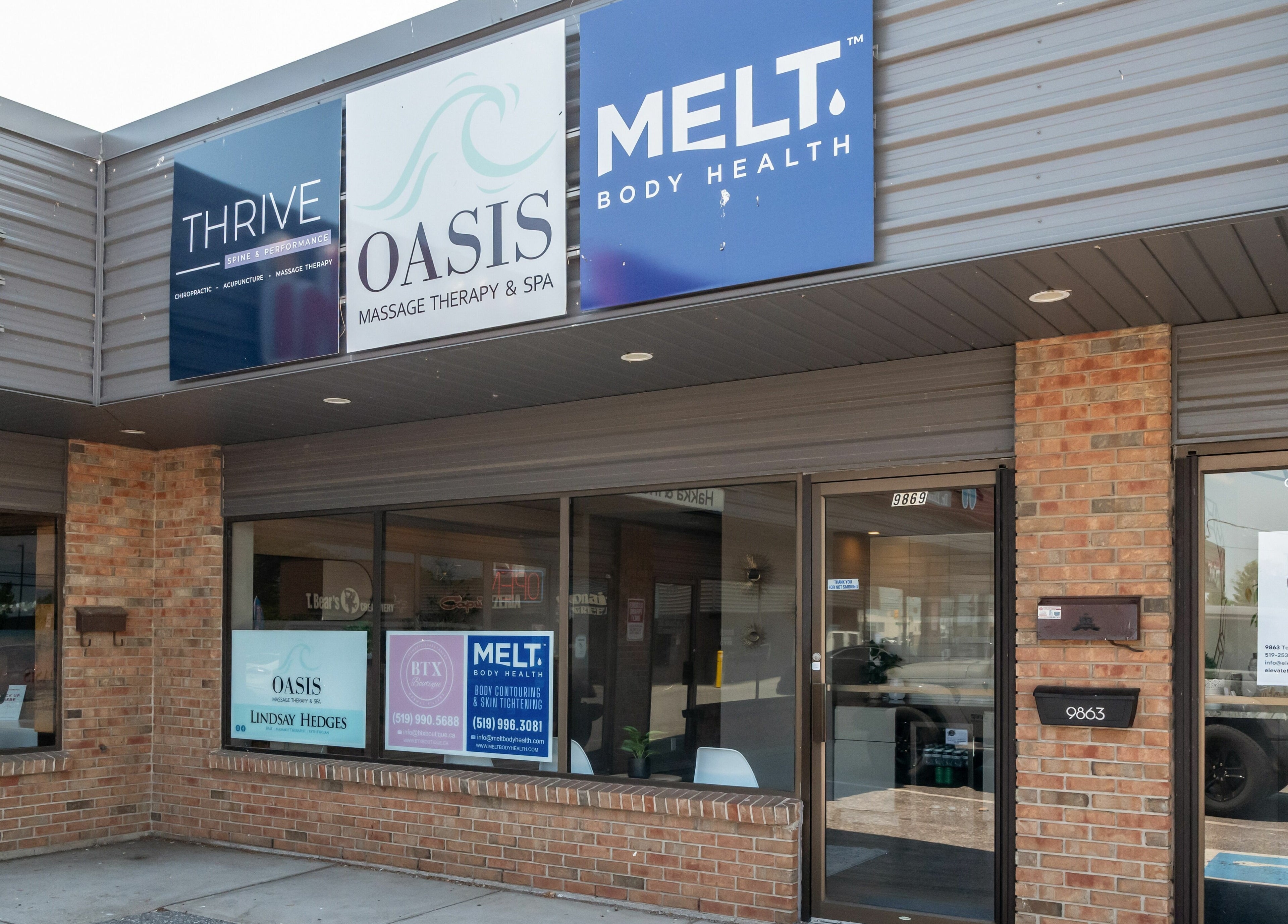 Melt Body Health entrance at Windsor, Ontario, CA, showcasing modern spa signage.
