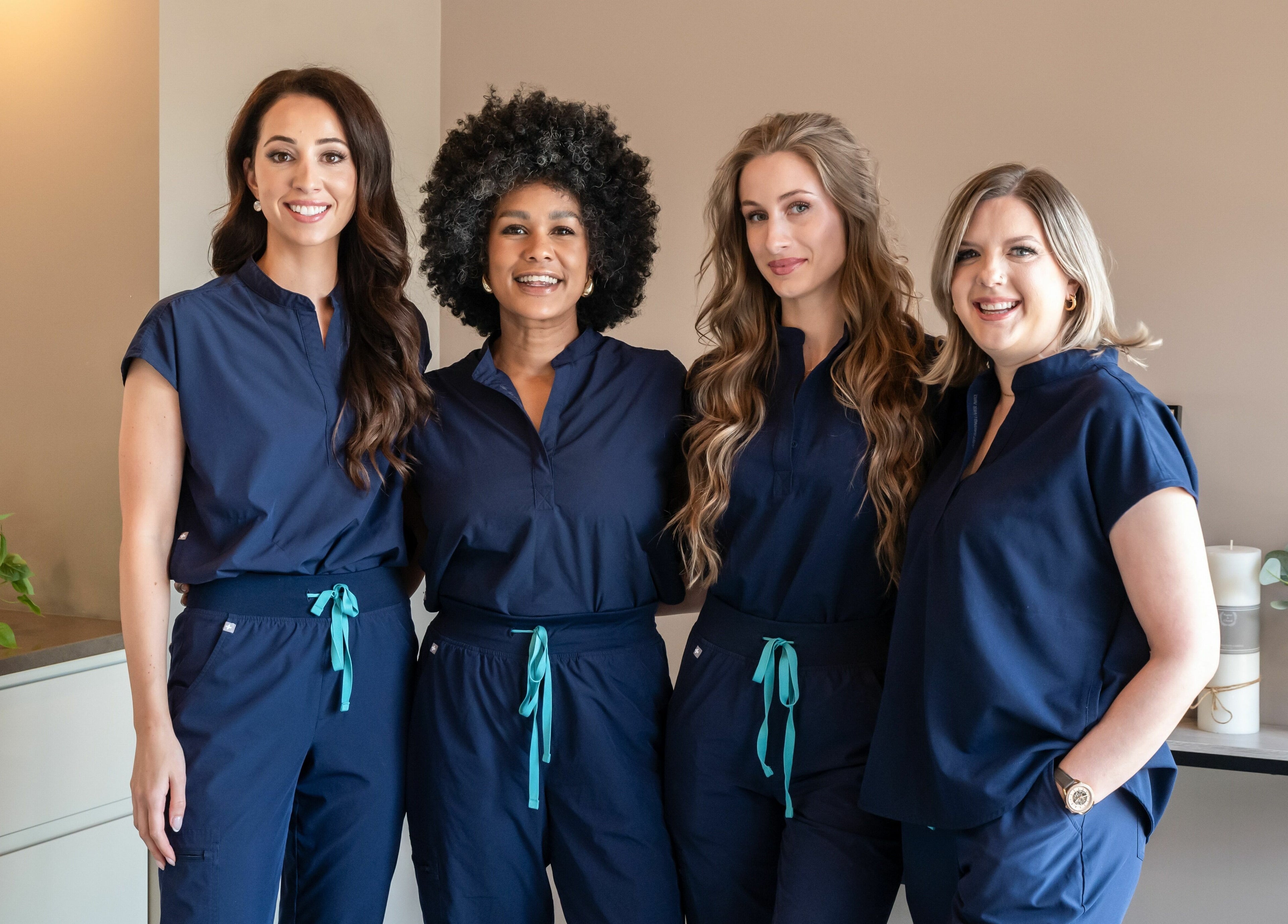 Professional team members of Melt Body Health in Windsor, Ontario, CA, showcasing unity and wellness expertise.