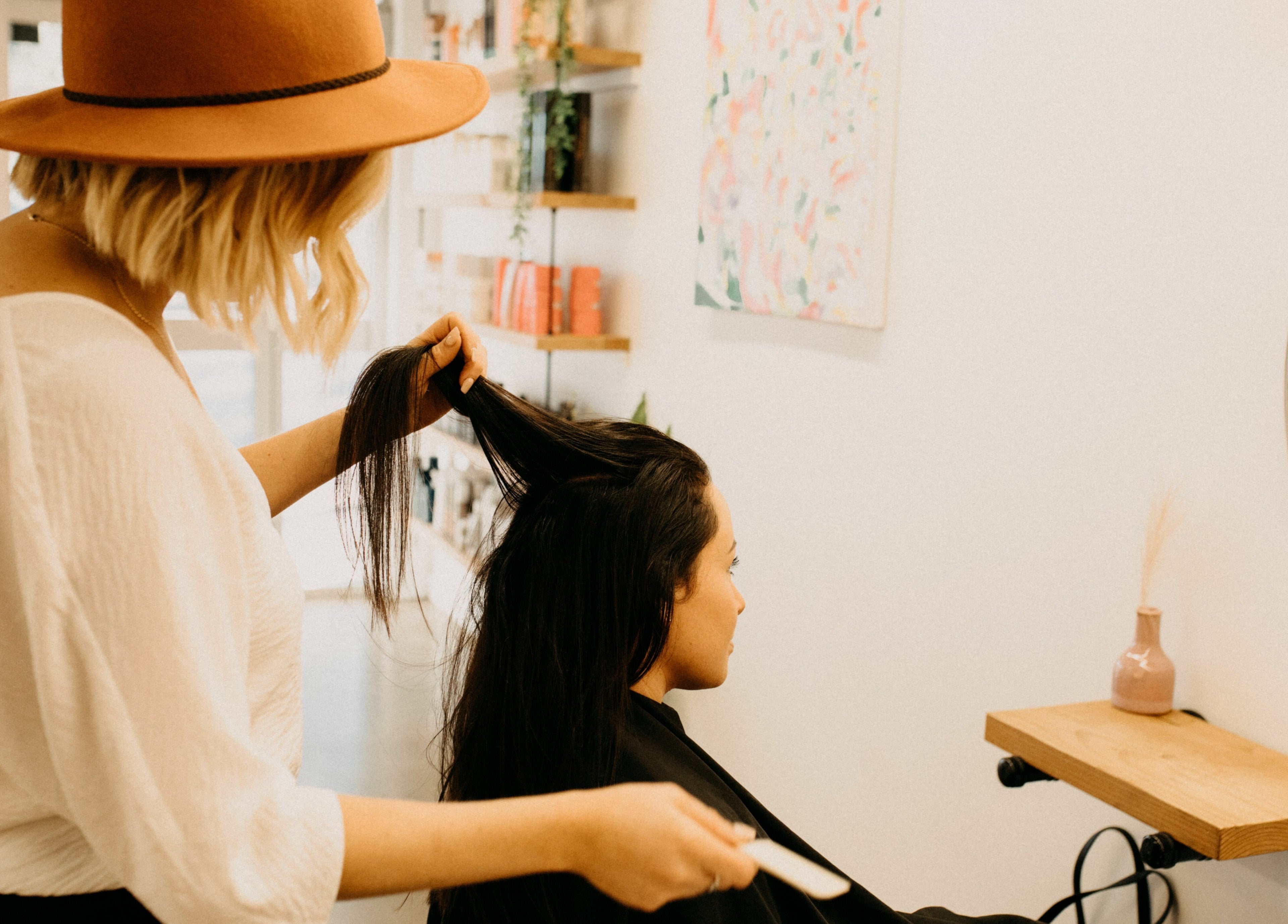 Stylist at The Color Room Glenbrook perfecting client's hair, Glenbrook, New South Wales, AU.
