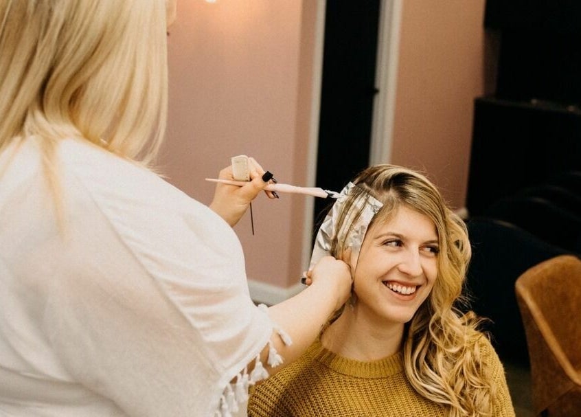 A stylist applies hair color at The Color Room Glenbrook in Glenbrook, New South Wales, AU.