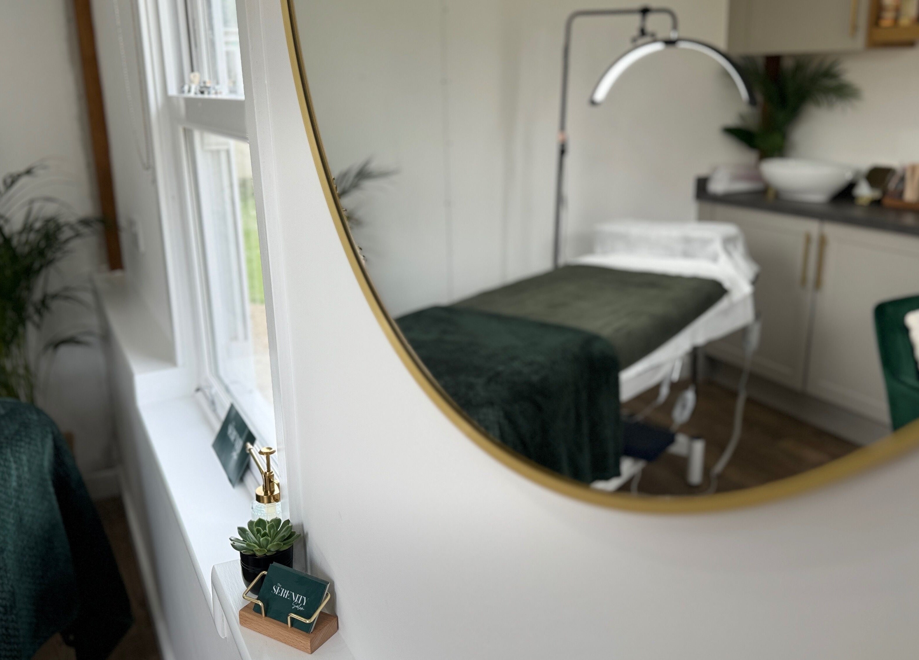 Elegant spa room at The Serenity Salon, Fareham, England, GB featuring a plush treatment bed and calming decor.