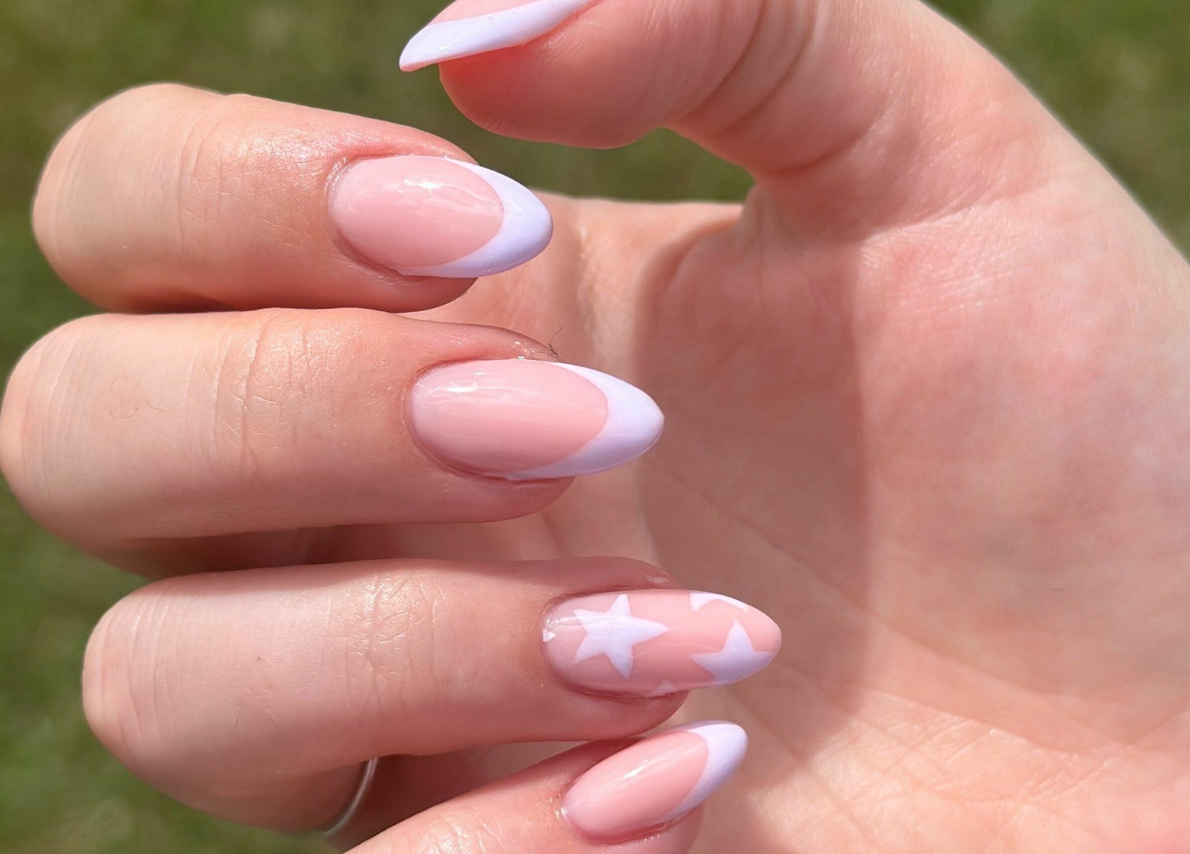 Glamorous star-themed French nails at Nail Alley, Waipu, Northland, NZ, showcasing elegant nail art.