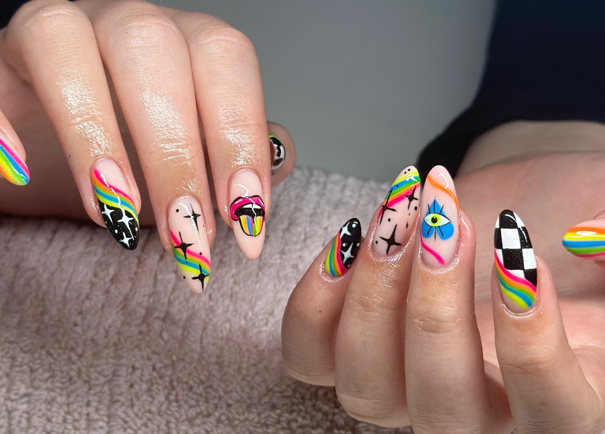Vibrant rainbow nail art at Nail Alley in Waipu, Northland, NZ, showcasing creative designs and expert craftsmanship.