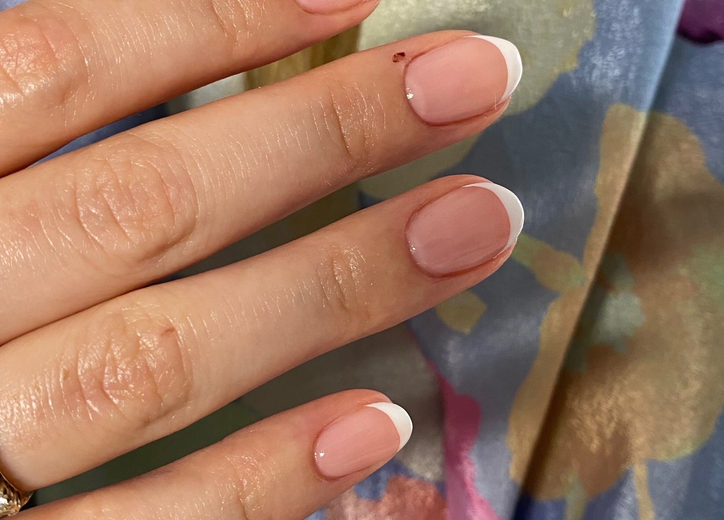 French manicure on hand at Asma Docrat London (London Fields | Shoreditch), London, England, GB.