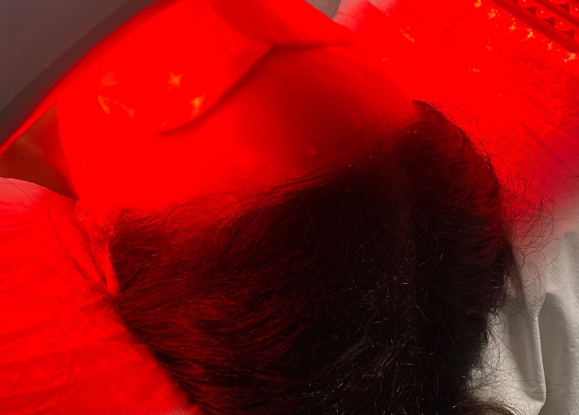 Red light therapy session at Asma Docrat London in London, England, GB, promoting skin wellness.