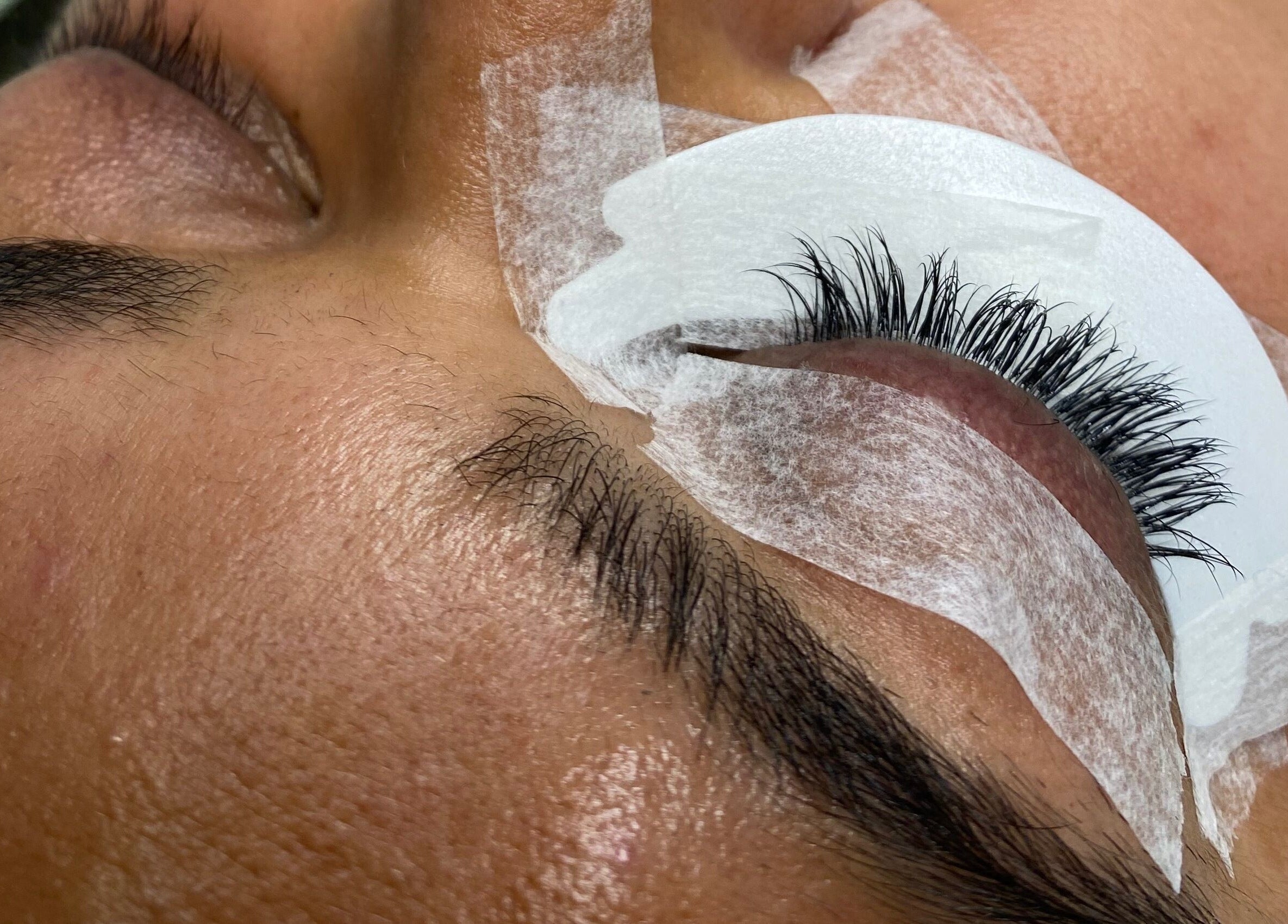 Eyelash extension treatment at Asma Docrat London in London, England, GB, showcasing precise lash application.