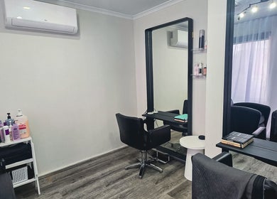 Modern styling station at Ark Hair Studio, Melbourne, Victoria, AU featuring salon chair and large mirror.