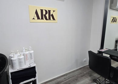 Ark Hair Studio interior featuring stylish chairs and product display in Melbourne, Victoria, AU.