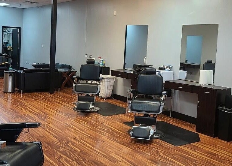 Modern interior of Blackbeard Barbering Company P.A in Fernandina Beach, Florida, US with stylish barber chairs.