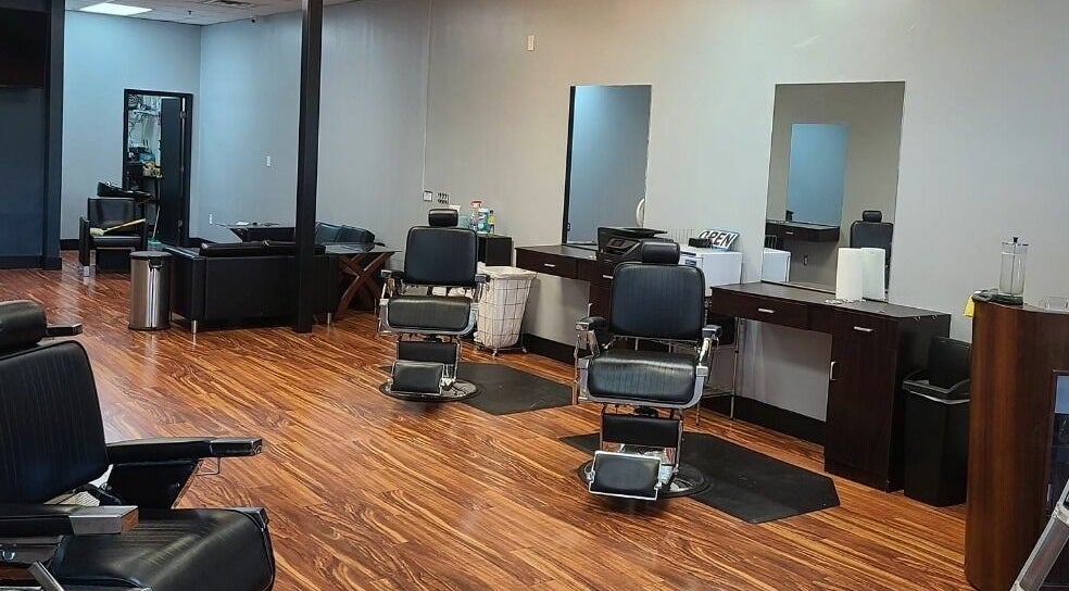 Modern interior of Blackbeard Barbering Company P.A in Fernandina Beach, Florida, US with stylish barber chairs.