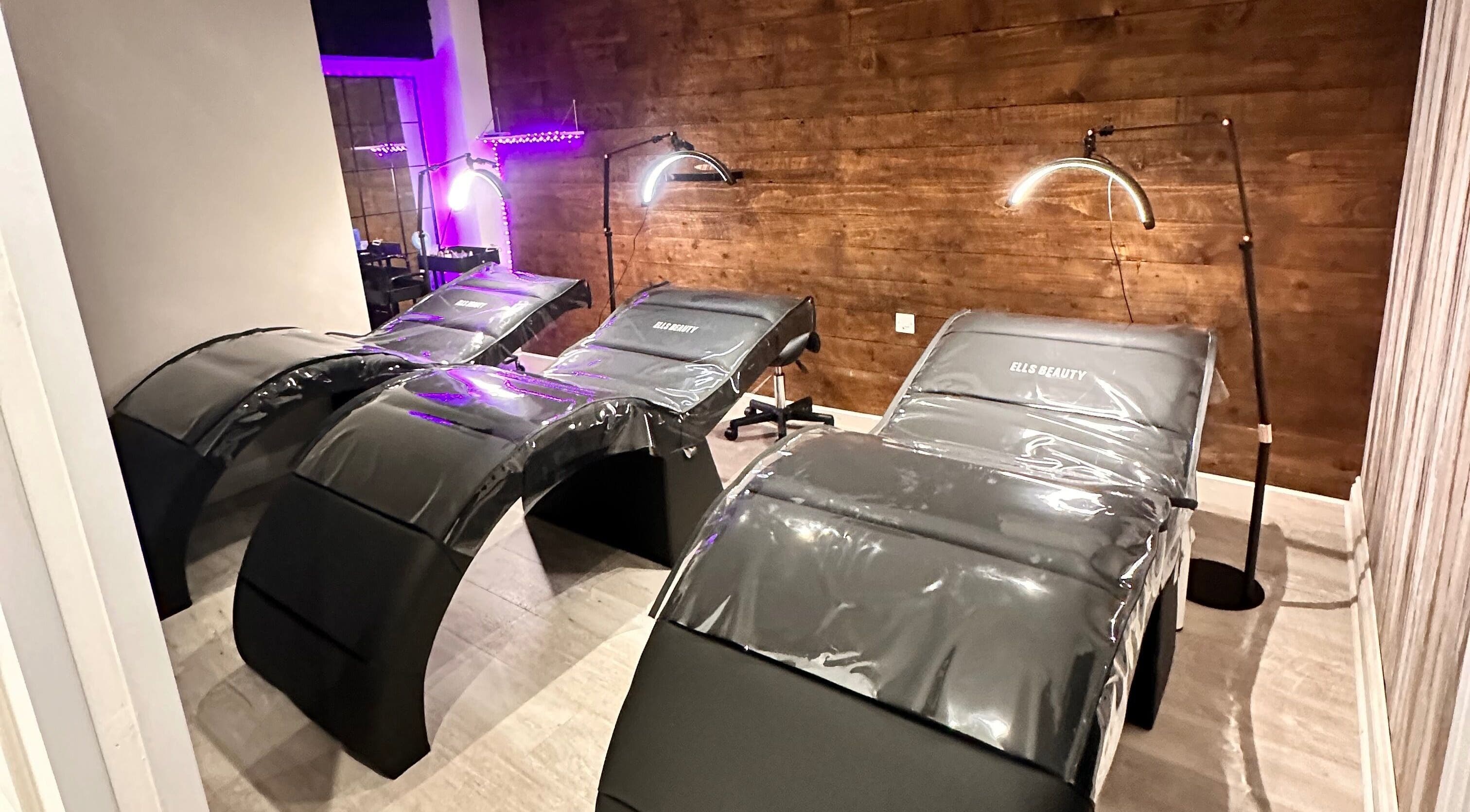 Luxurious treatment beds at Ells Beauty in Brightlingsea, England, GB lit by soft lighting.