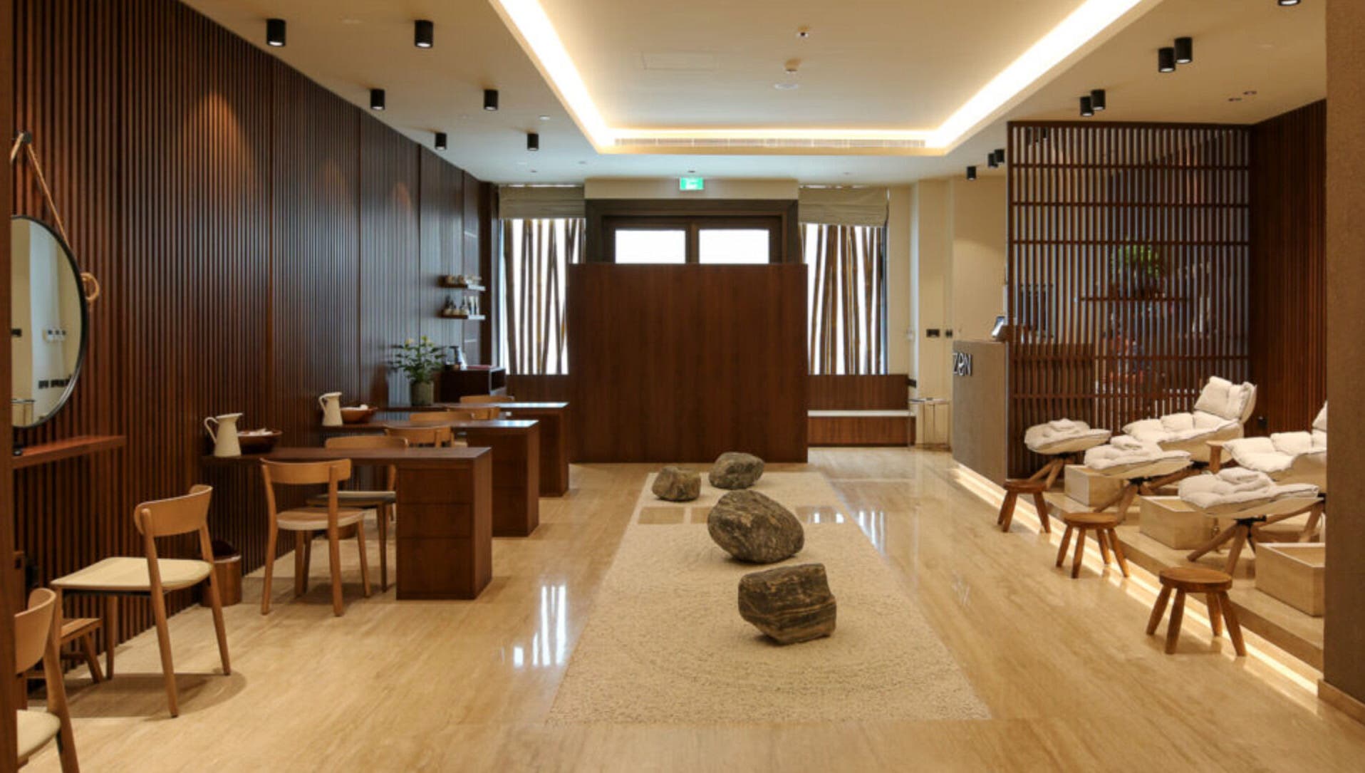 Relaxing interior of Zen Spa, Doha, Doha, QA, featuring tranquil seating and calming earth tones.