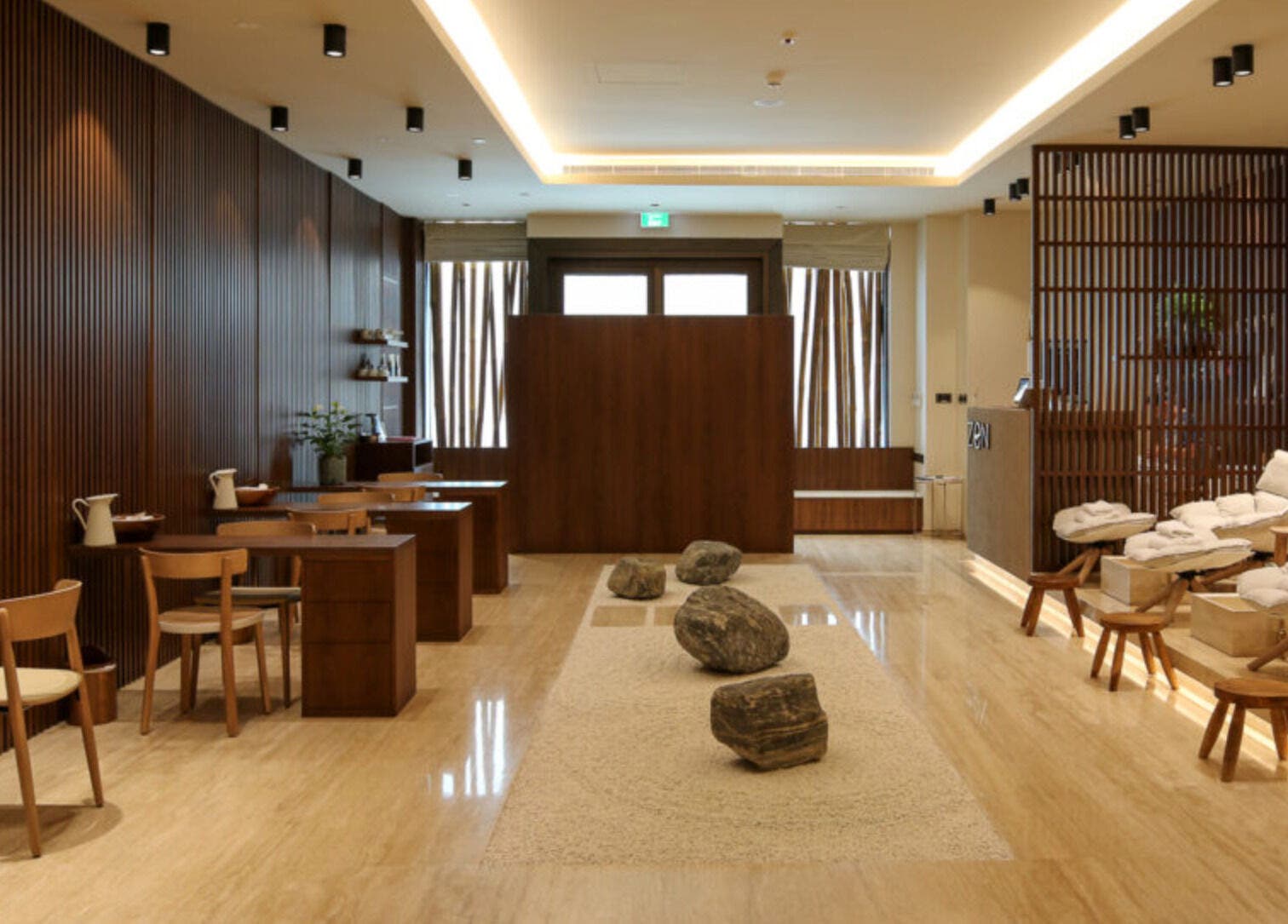 Relaxing interior of Zen Spa, Doha, Doha, QA, featuring tranquil seating and calming earth tones.