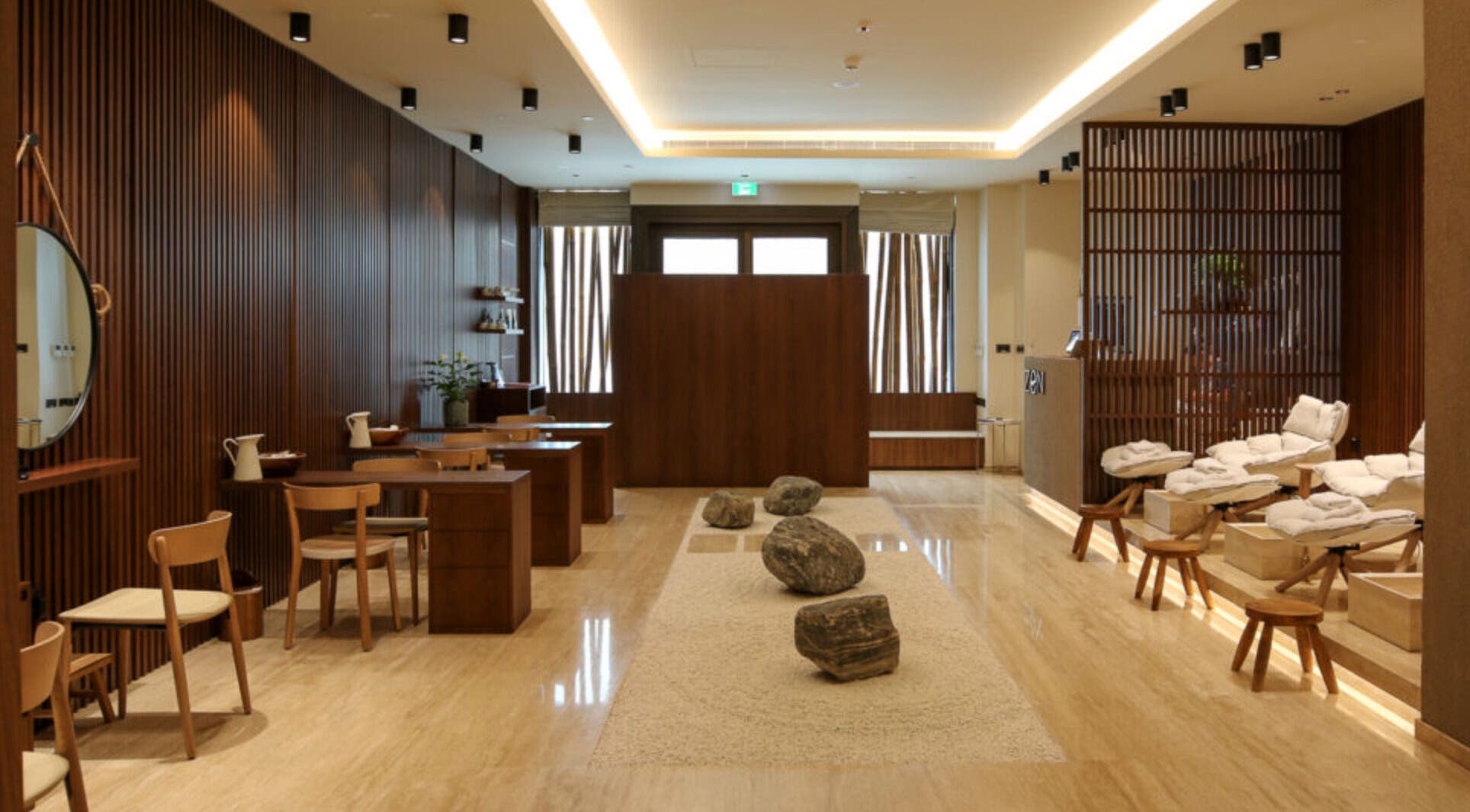 Relaxing interior of Zen Spa, Doha, Doha, QA, featuring tranquil seating and calming earth tones.
