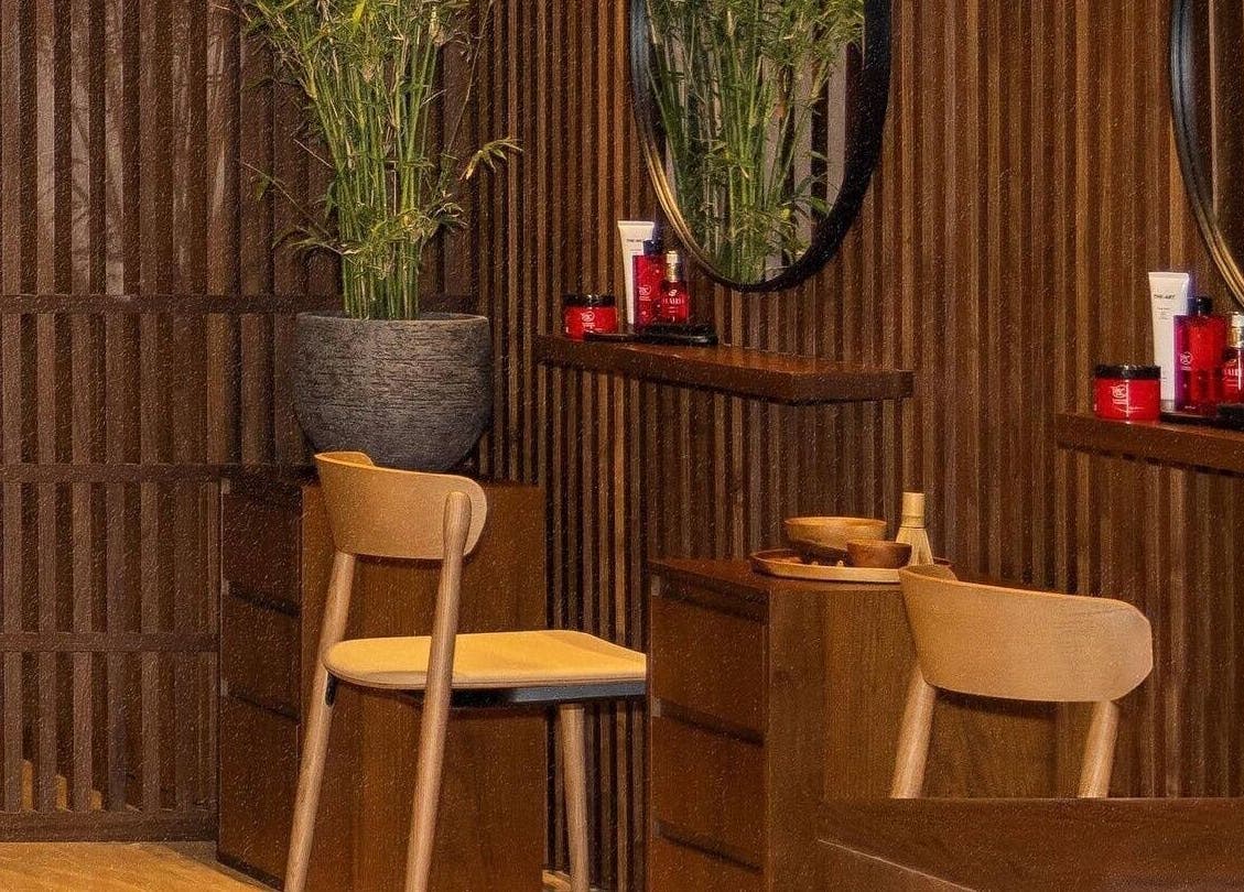 Cozy wooden interiors at Zen Spa, Doha, Doha, QA, featuring relaxing chairs and organic decor.