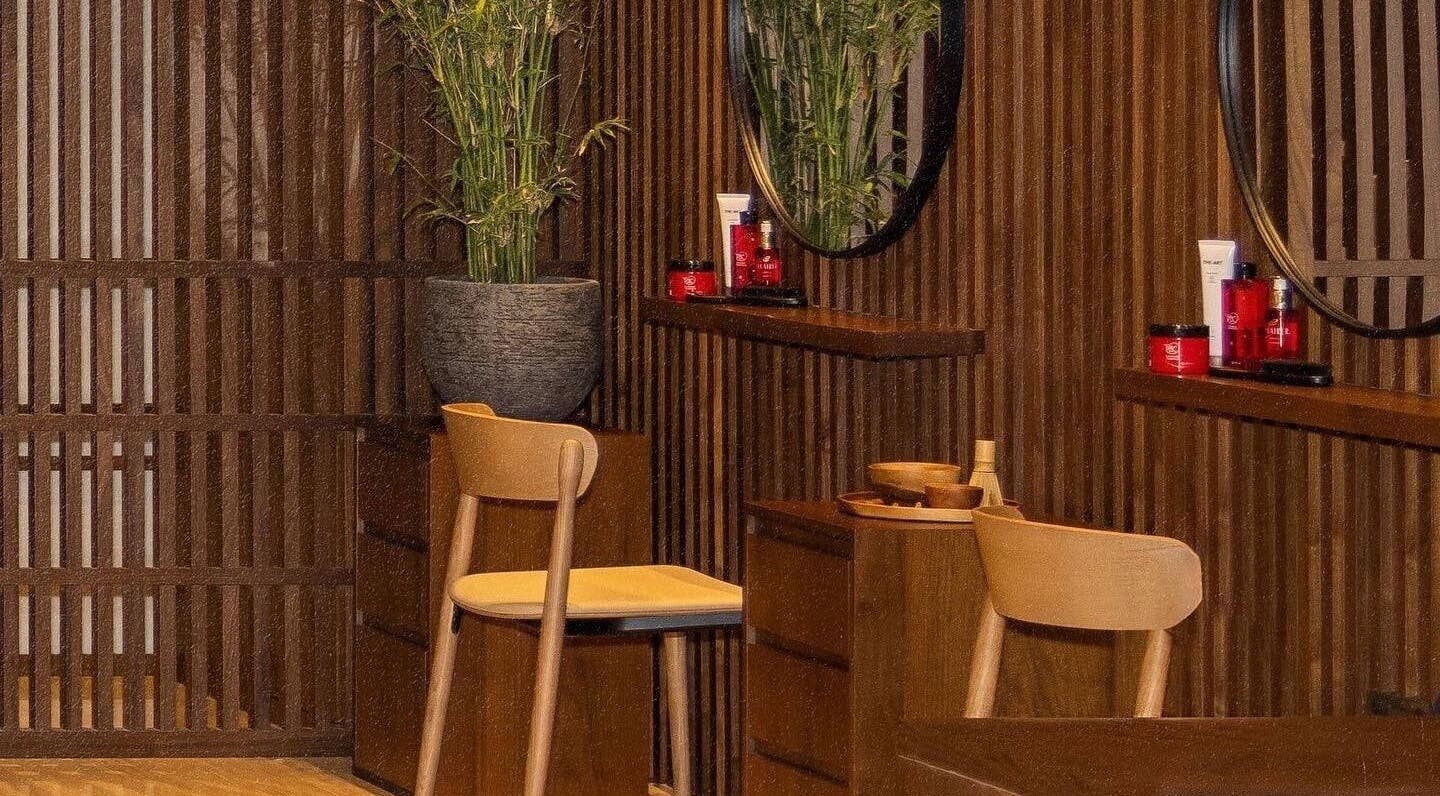 Cozy wooden interiors at Zen Spa, Doha, Doha, QA, featuring relaxing chairs and organic decor.