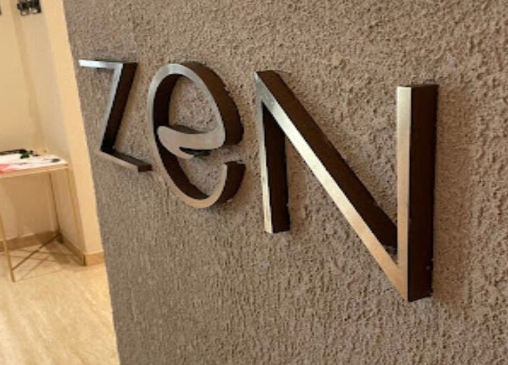 Modern Zen Spa wall sign at entrance in Doha, Doha, QA, welcoming visitors to relaxation.