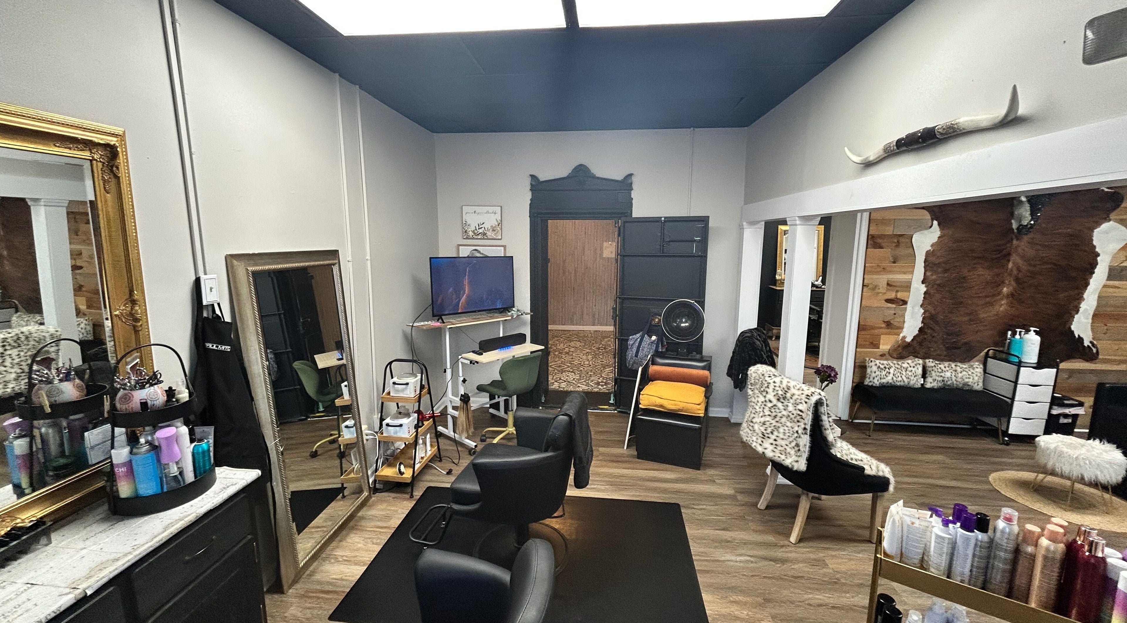 Modern salon interior of More Good Hair Days Salon in Forsyth, Georgia, US with stylish seating and mirrors.