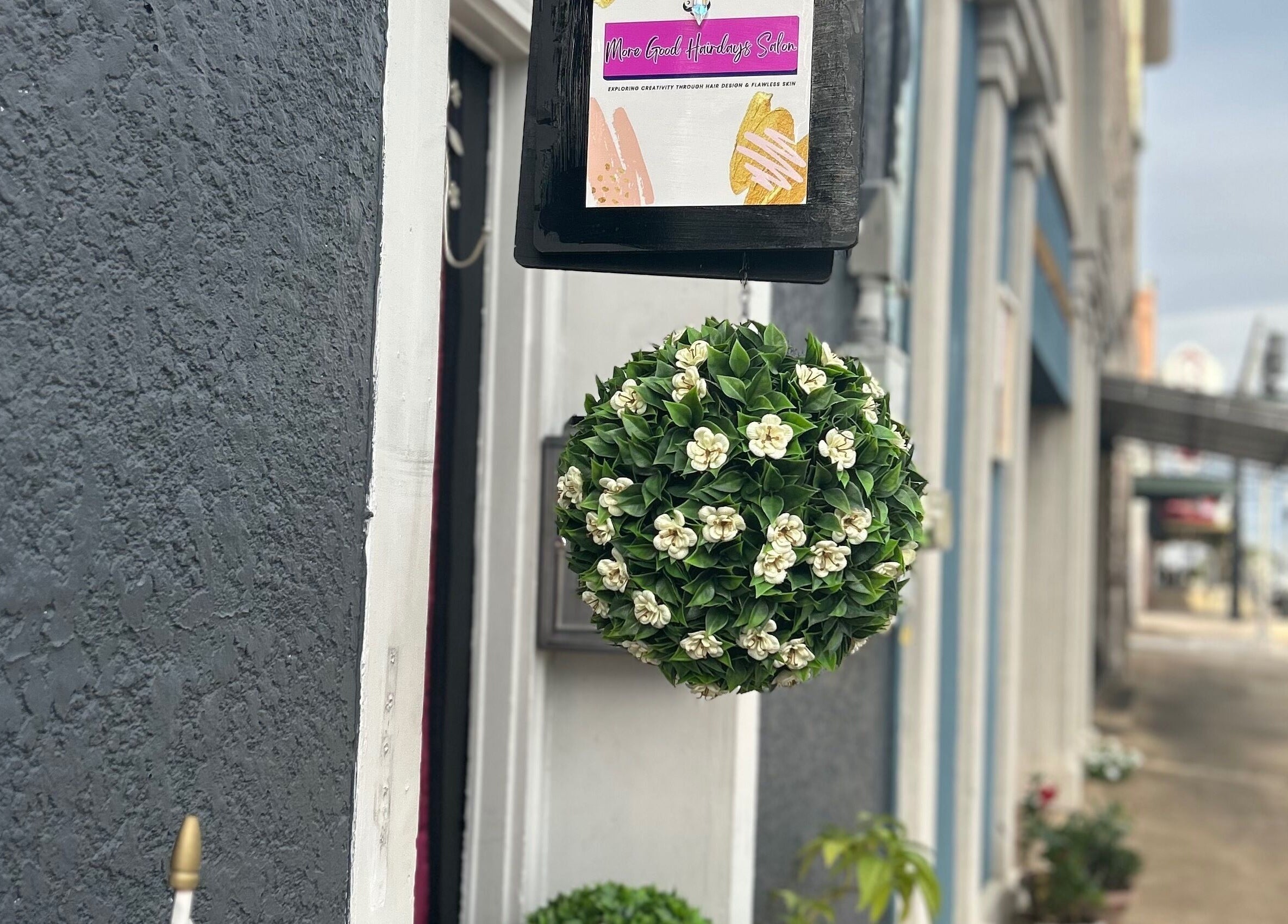 More Good Hair Days Salon entrance with flower decor in Forsyth, Georgia, US.