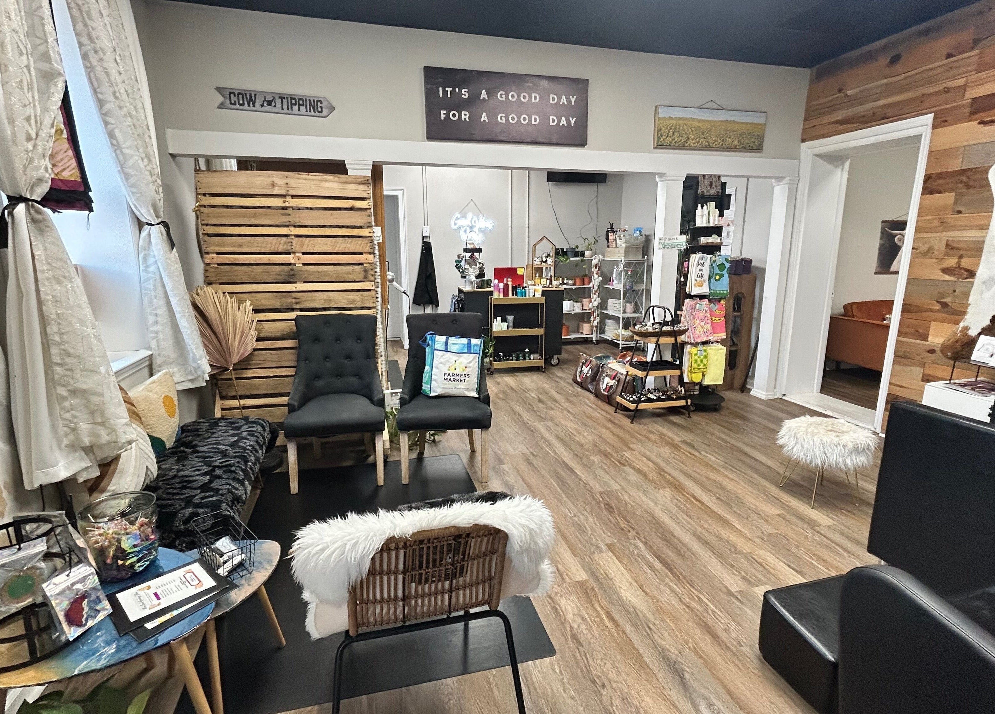 Stylish interior of More Good Hair Days Salon in Forsyth, Georgia, US featuring modern seating and decor.