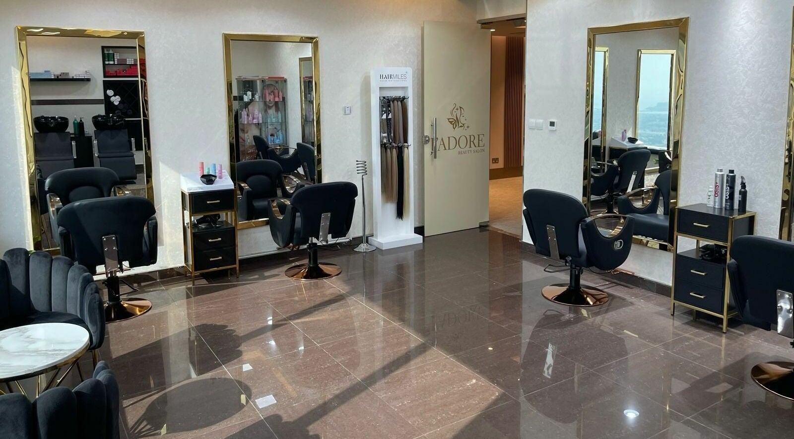 Interior of Jadore Beauty Salon in Dubai, AE, featuring stylish seating and mirrors for a luxurious experience.