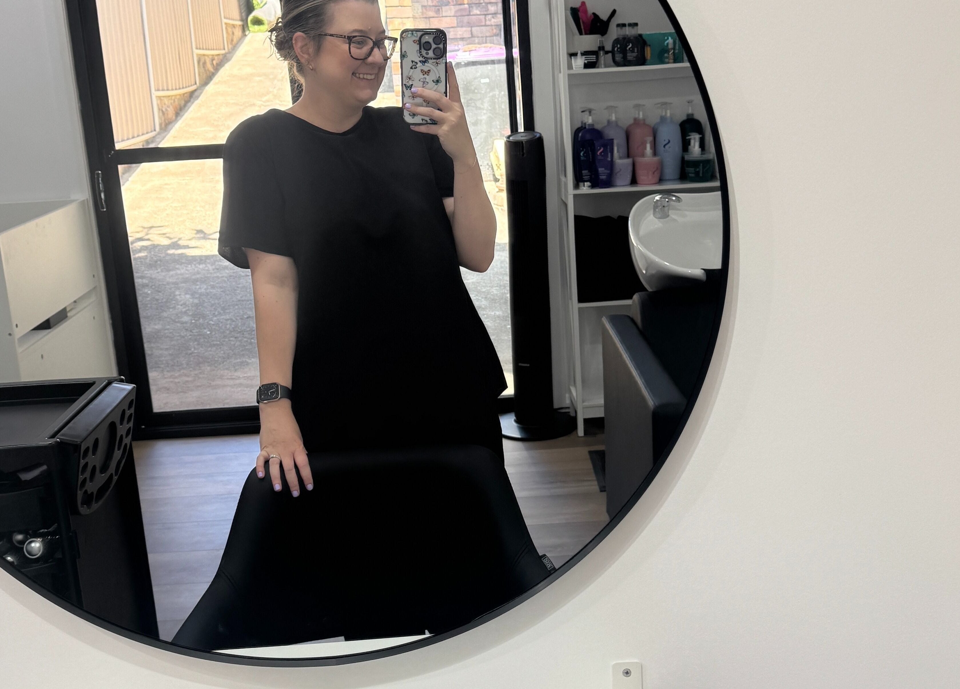 Inside HairEm Creations salon in Kirrawee, New South Wales, AU, showcasing a stylish mirror and salon equipment.