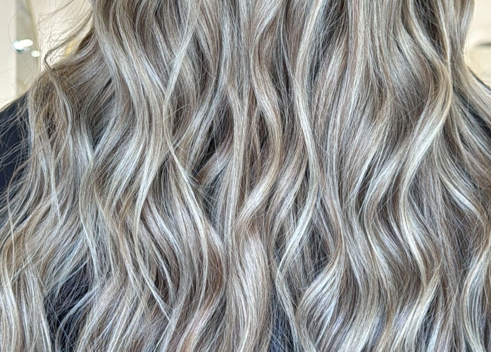 Elegant wavy blonde hairstyle at HairEm Creations, Kirrawee, New South Wales, AU.