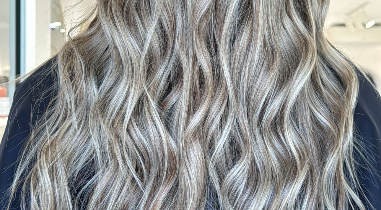 Elegant wavy blonde hairstyle at HairEm Creations, Kirrawee, New South Wales, AU.