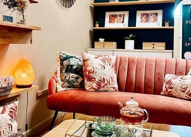 Chic and cozy lounge at Belle Áme Beautique, Gladstone Central, QLD, AU, with elegant decor and soft lighting.