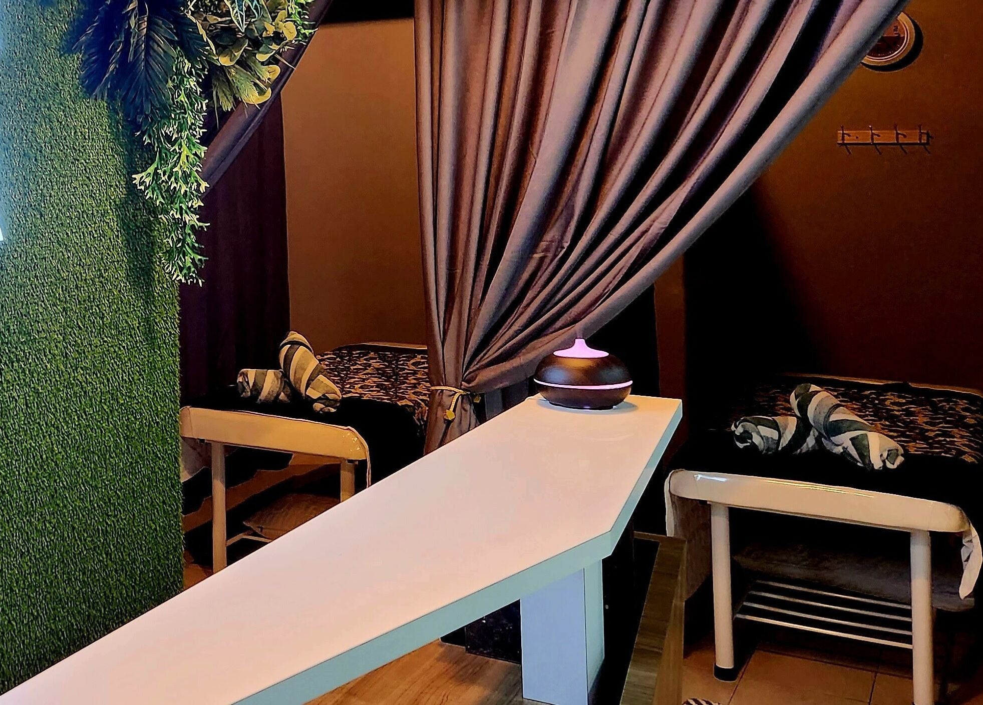 Calming massage area at LAWA LAWA SPA @Larkin Sentral, Johor Bahru, Johor, MY with lush decor and cozy beds.