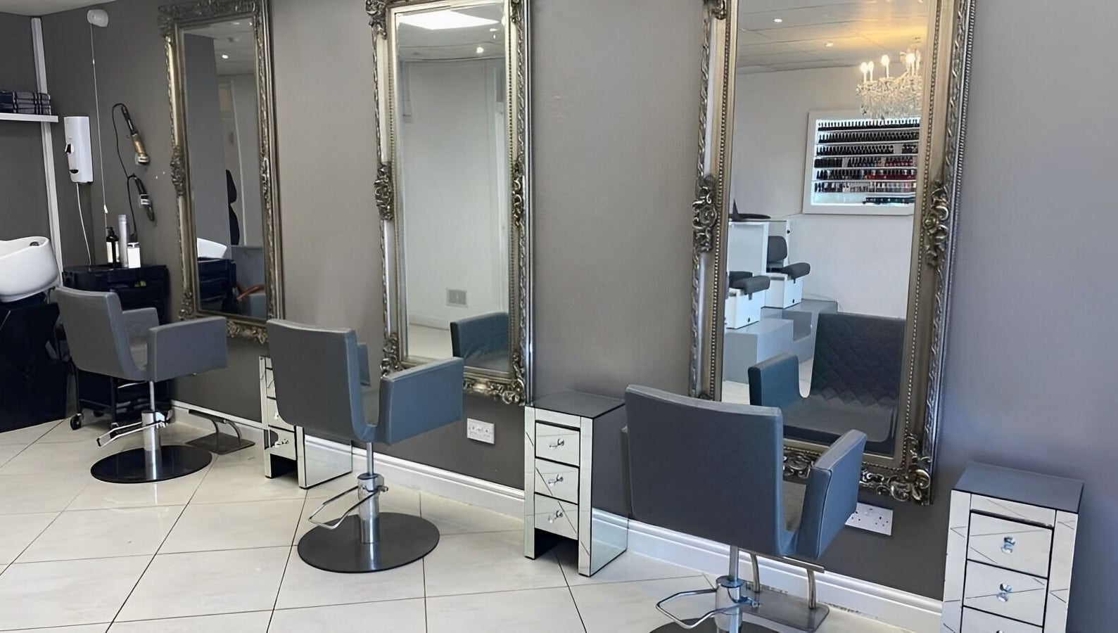 Chic salon chairs and mirrors at Beautiful Bodies & Aesthetics in Bournemouth, England, GB.