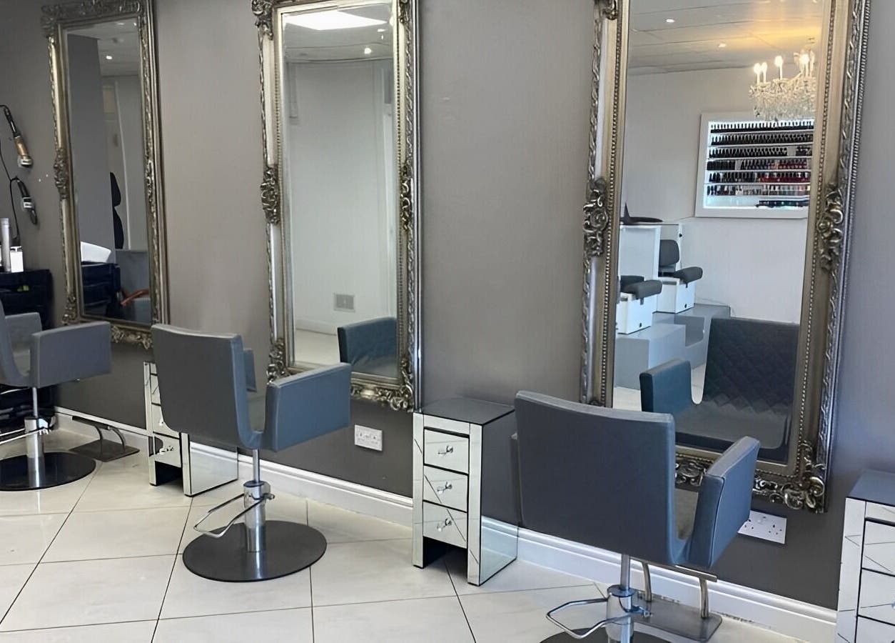 Chic salon chairs and mirrors at Beautiful Bodies & Aesthetics in Bournemouth, England, GB.