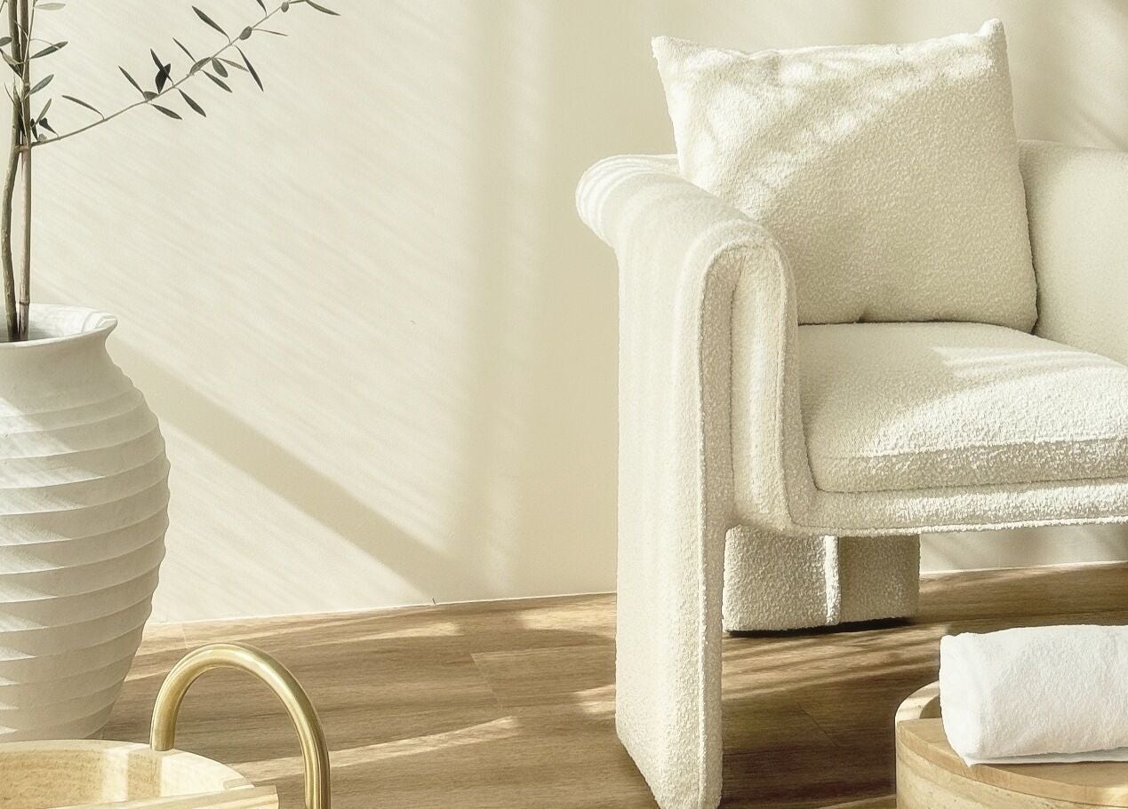 Relaxing corner at Séjour Spa and Nails, Eastgardens, NSW, featuring a plush chair and elegant decor.