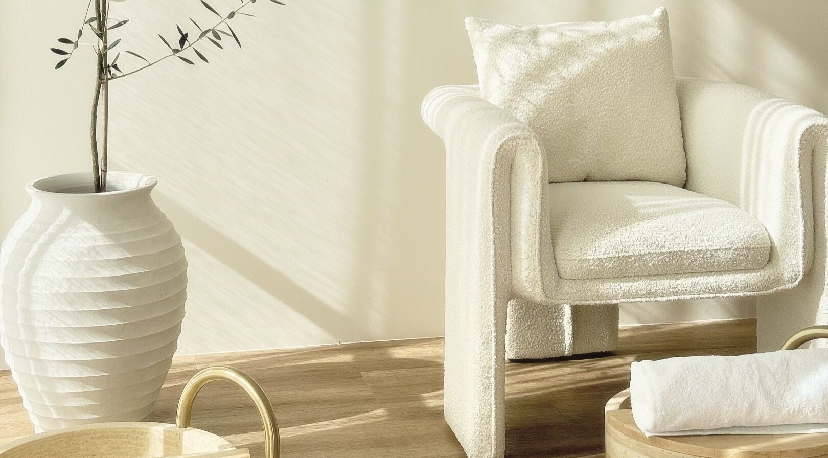 Relaxing corner at Séjour Spa and Nails, Eastgardens, NSW, featuring a plush chair and elegant decor.