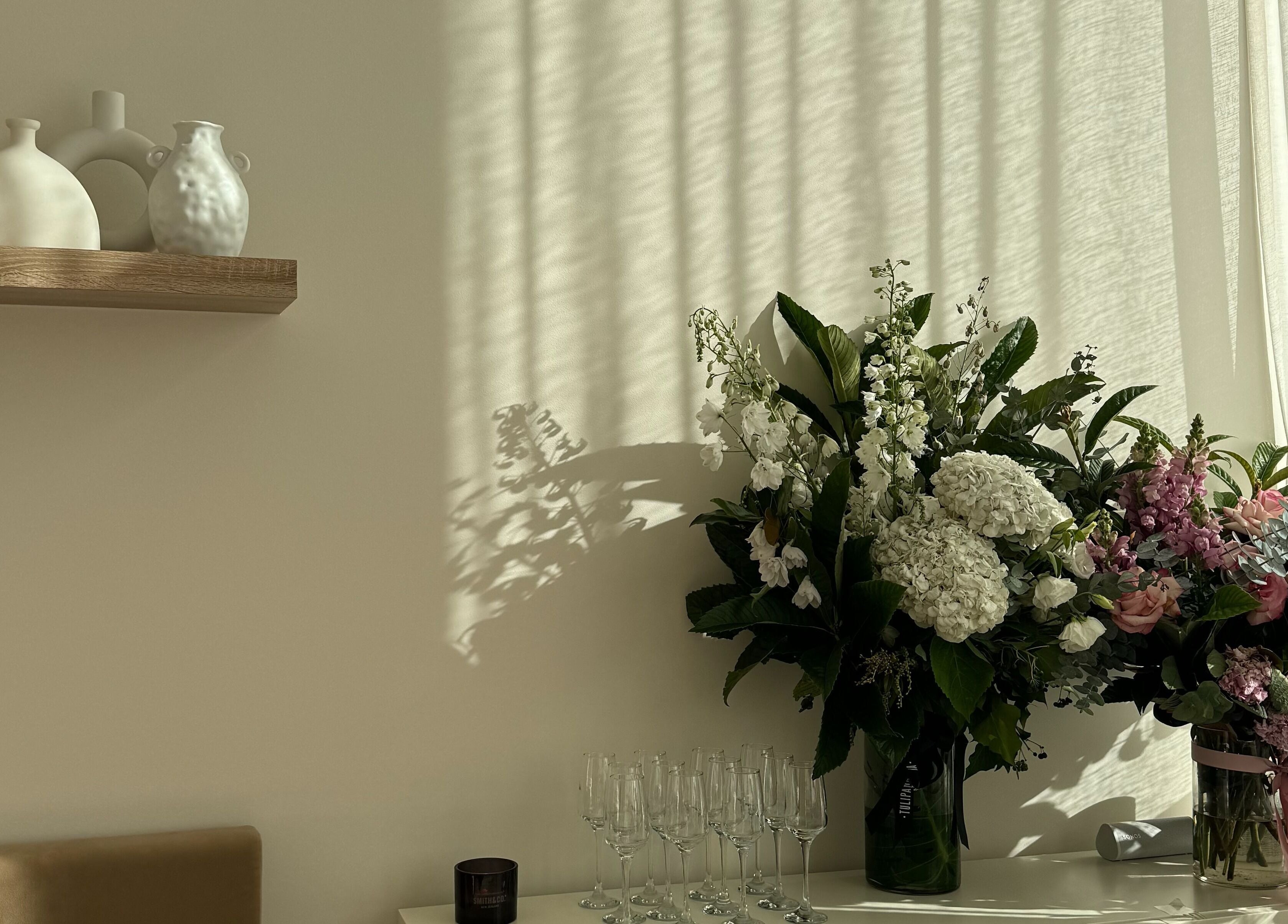 Elegant flower arrangement in soft lighting at Séjour Spa and Nails, Eastgardens, New South Wales, AU.