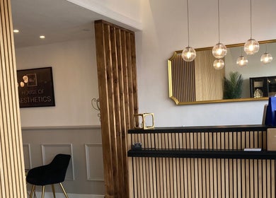 Elegant reception area at Lucy Angel, Lowestoft, GB with chic decor and warm lighting.