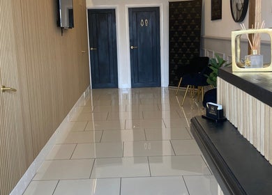 Sophisticated, modern hallway at Lucy Angel, Lowestoft, GB with sleek decor and seating.
