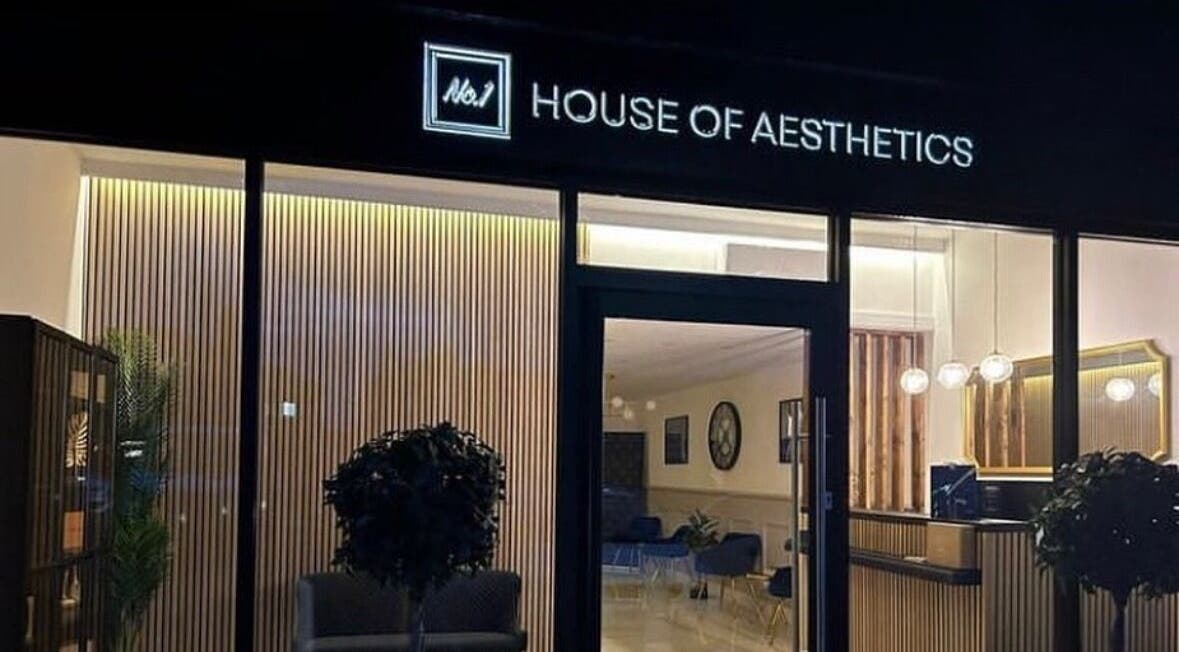 Lucy Angel's elegant and warmly lit entrance in Lowestoft, GB showcases a sleek and inviting aesthetic.