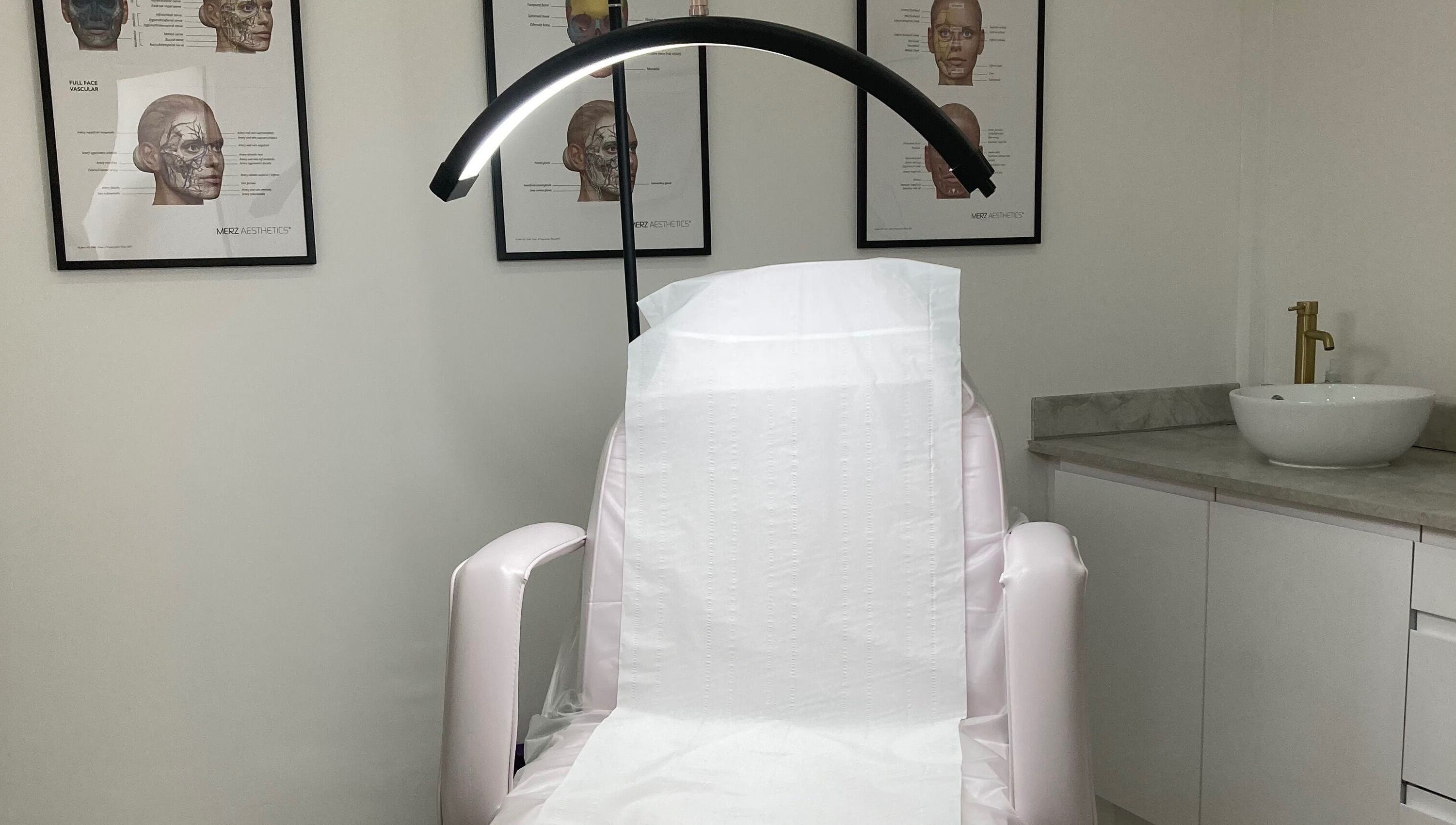 Calm treatment room at Lucy Angel in Lowestoft, GB, featuring a spa chair and elegant decor.
