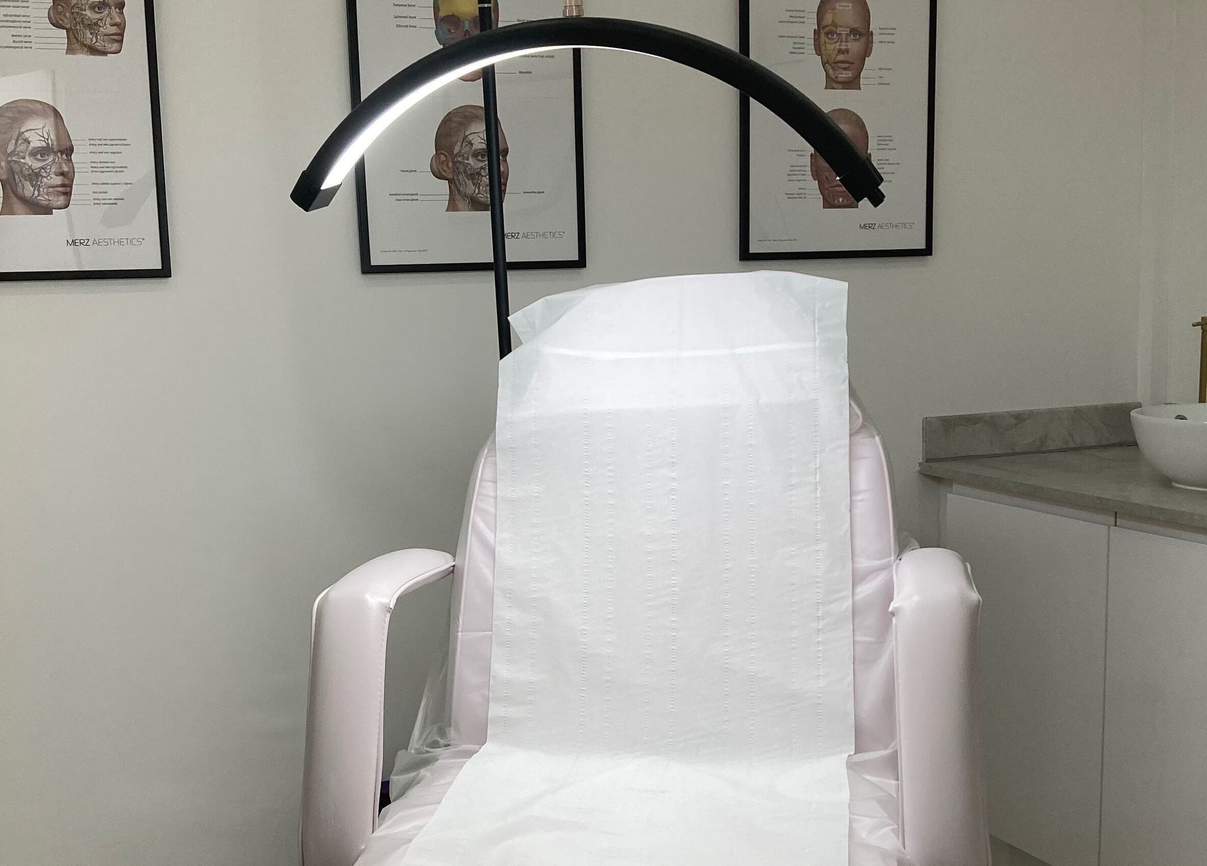 Calm treatment room at Lucy Angel in Lowestoft, GB, featuring a spa chair and elegant decor.