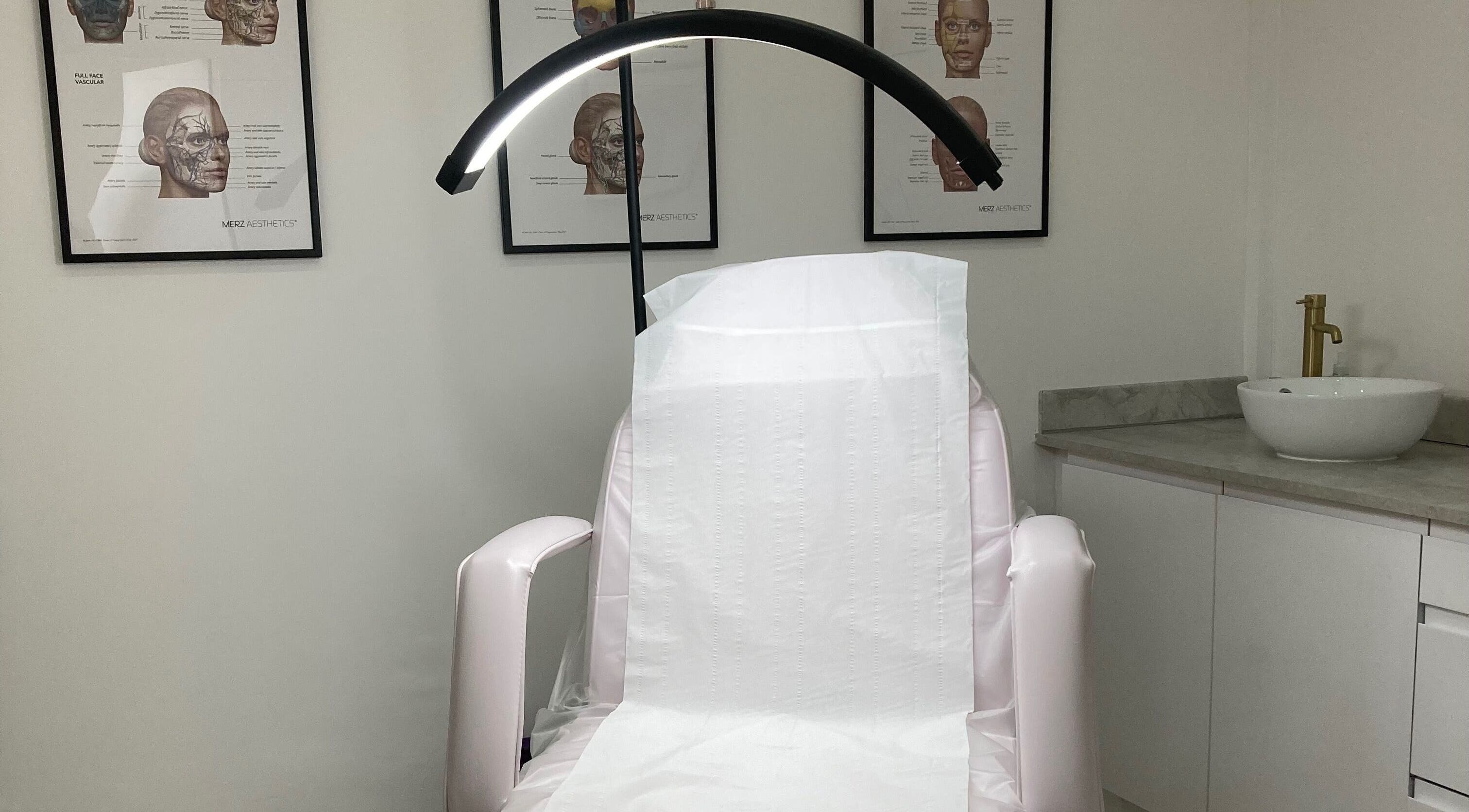 Calm treatment room at Lucy Angel in Lowestoft, GB, featuring a spa chair and elegant decor.