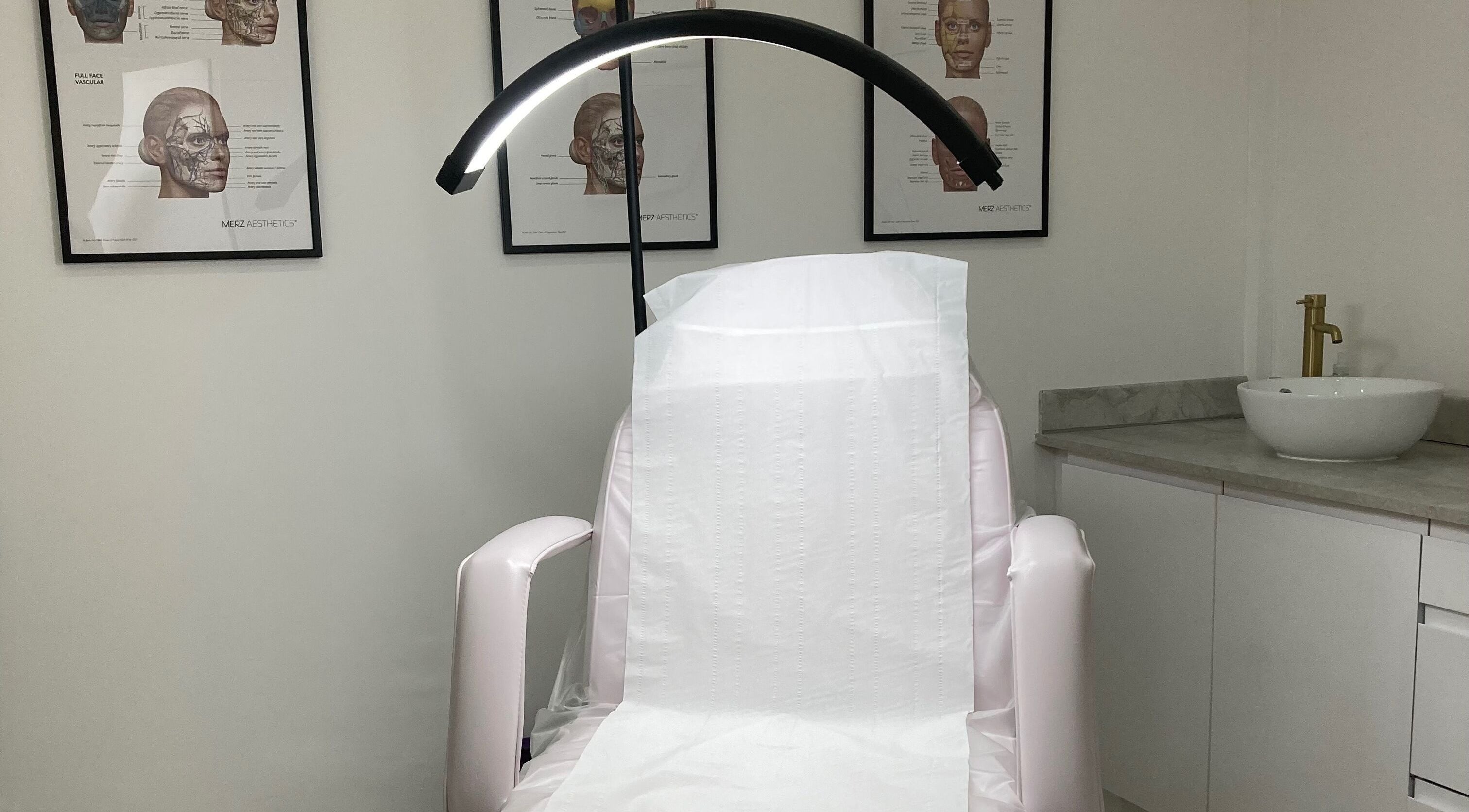 Calm treatment room at Lucy Angel in Lowestoft, GB, featuring a spa chair and elegant decor.